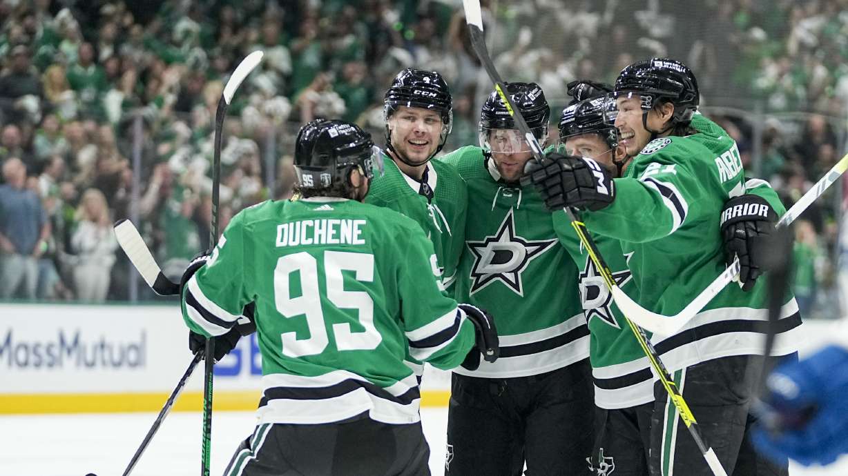 Dallas Stars players celebrate a goal by Joe Pavelski, center, during the first period in Game 5 of an NHL hockey Stanley Cup second-round playoff series against the Colorado Avalanche, Wednesday, May 15, 2024, in Dallas.