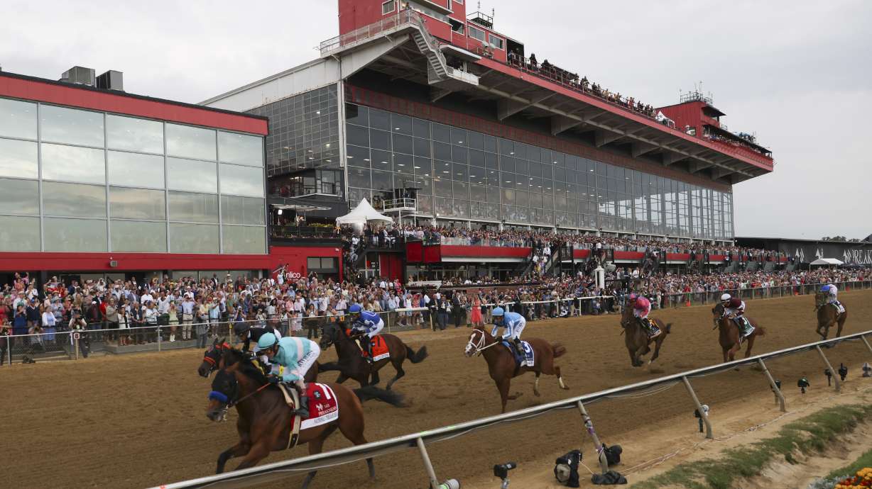 FILE - National Treasure, bottom left, with John Velazquez, leads the pack toward the first turn during the148th running of the Preakness Stakes horse race at Pimlico Race Course, May 20, 2023, in Baltimore. Maryland Gov. Wes Moore signed a measure on Thursday, May 9, 2024, to rebuild Baltimore’s historic but antiquated Pimlico Race Course and transfer the track to state control.