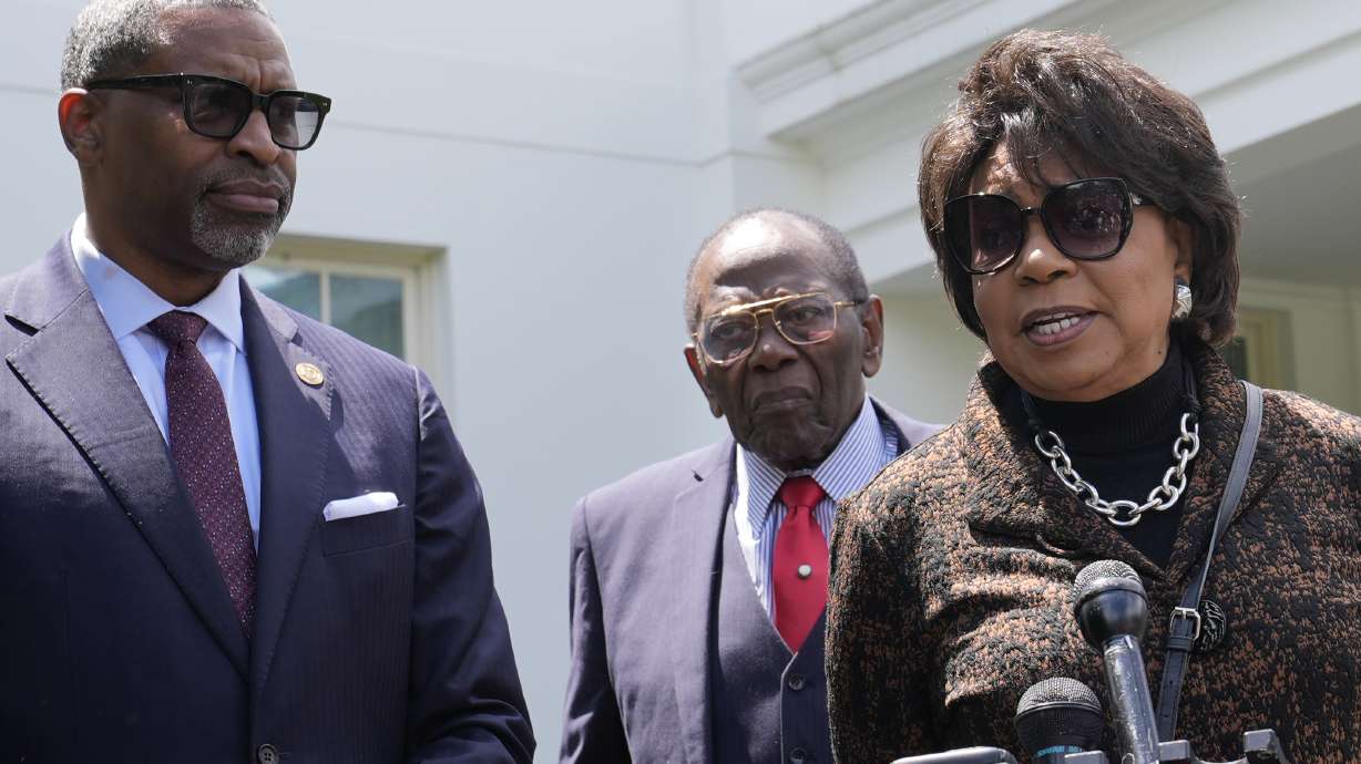 Cheryl Brown Henderson, right, daughter of Brown v. Board of Education named plaintiff Oliver Brown, speaks to reporters outside the White House in Washington, Thursday, following a meeting with President Joe Biden to mark the 70th anniversary of the historic Supreme Court decision.