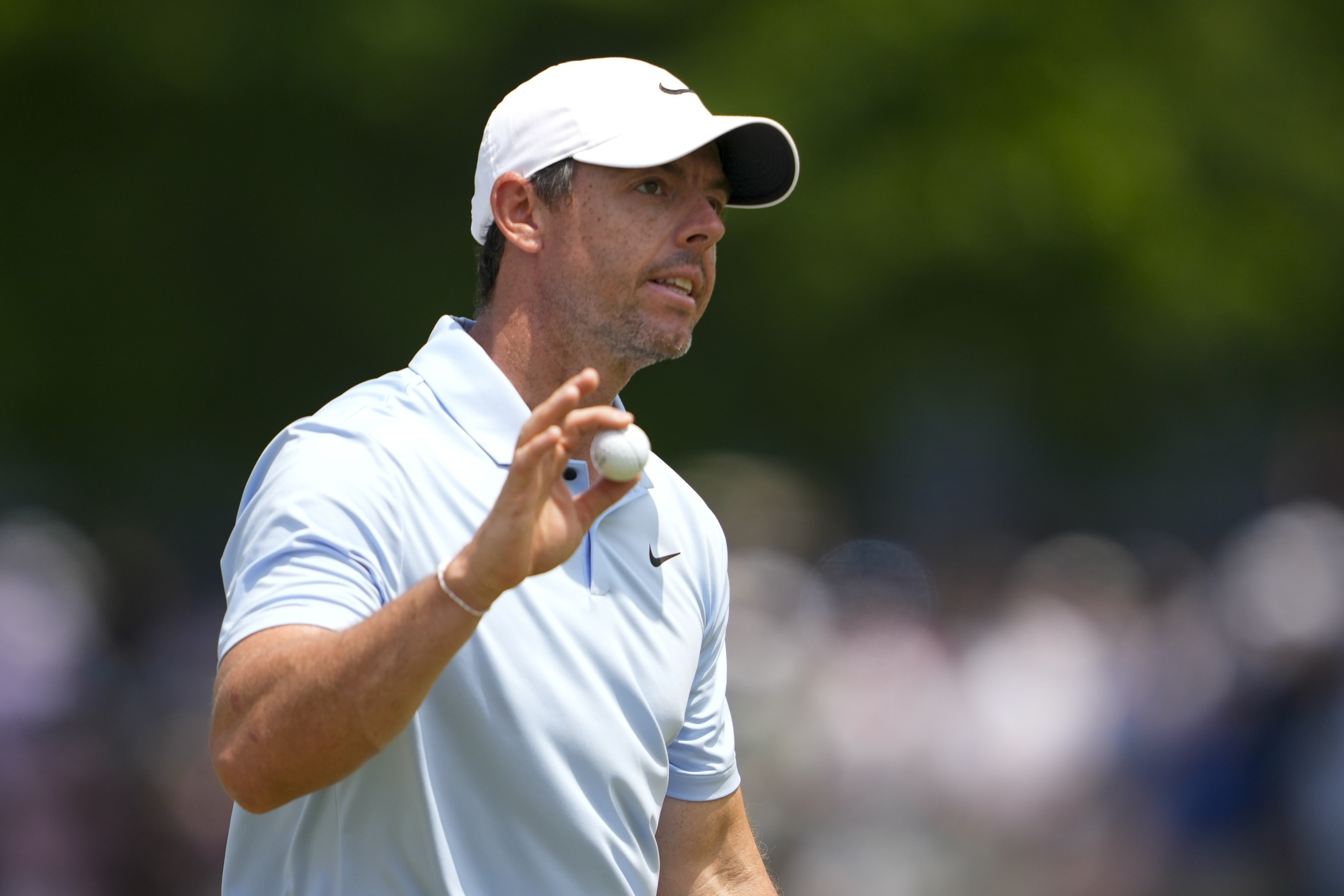 Rory McIlroy, of Northern Ireland, waves after making a putt on the ninth hole during the first round of the PGA Championship golf tournament at the Valhalla Golf Club, Thursday, May 16, 2024, in Louisville, Ky.