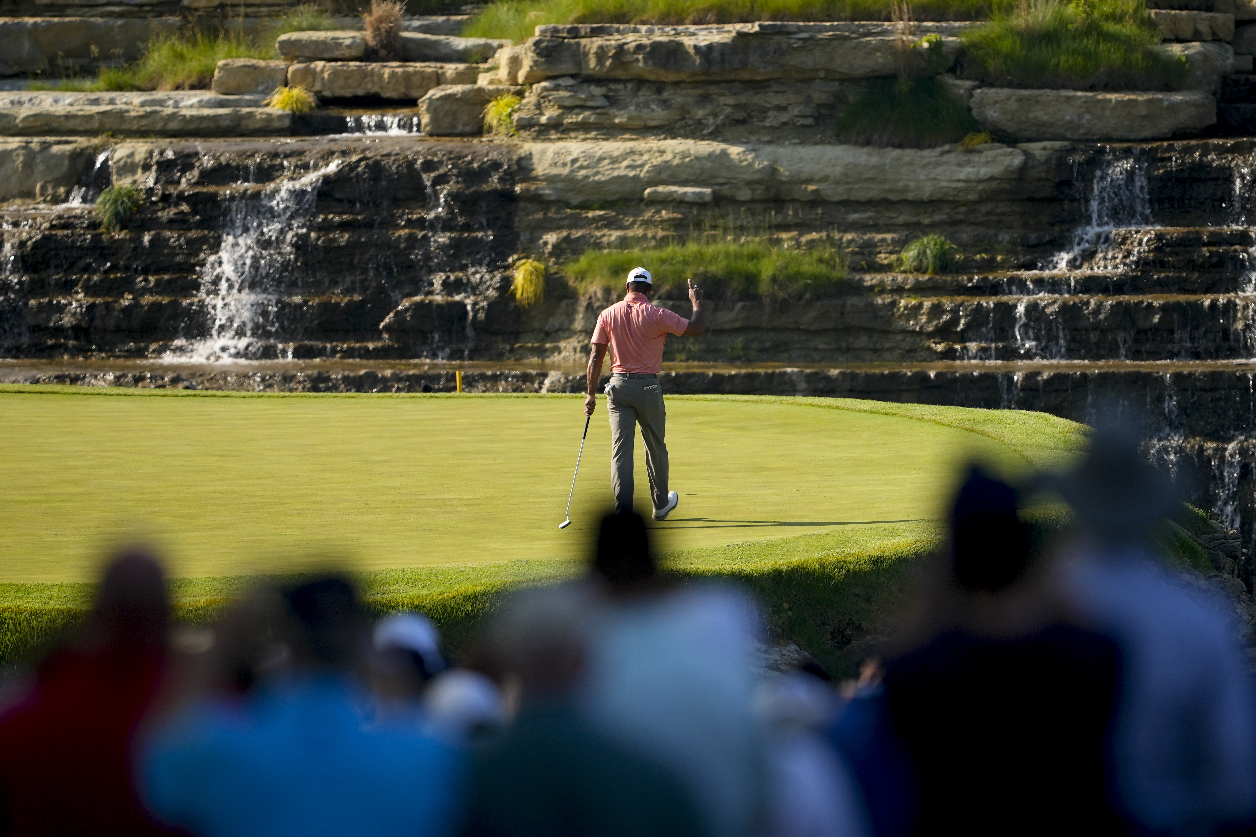 Tiger Woods waves after making a putt on the 13th hole during the first round of the PGA Championship golf tournament at the Valhalla Golf Club, Thursday, May 16, 2024, in Louisville, Ky. 