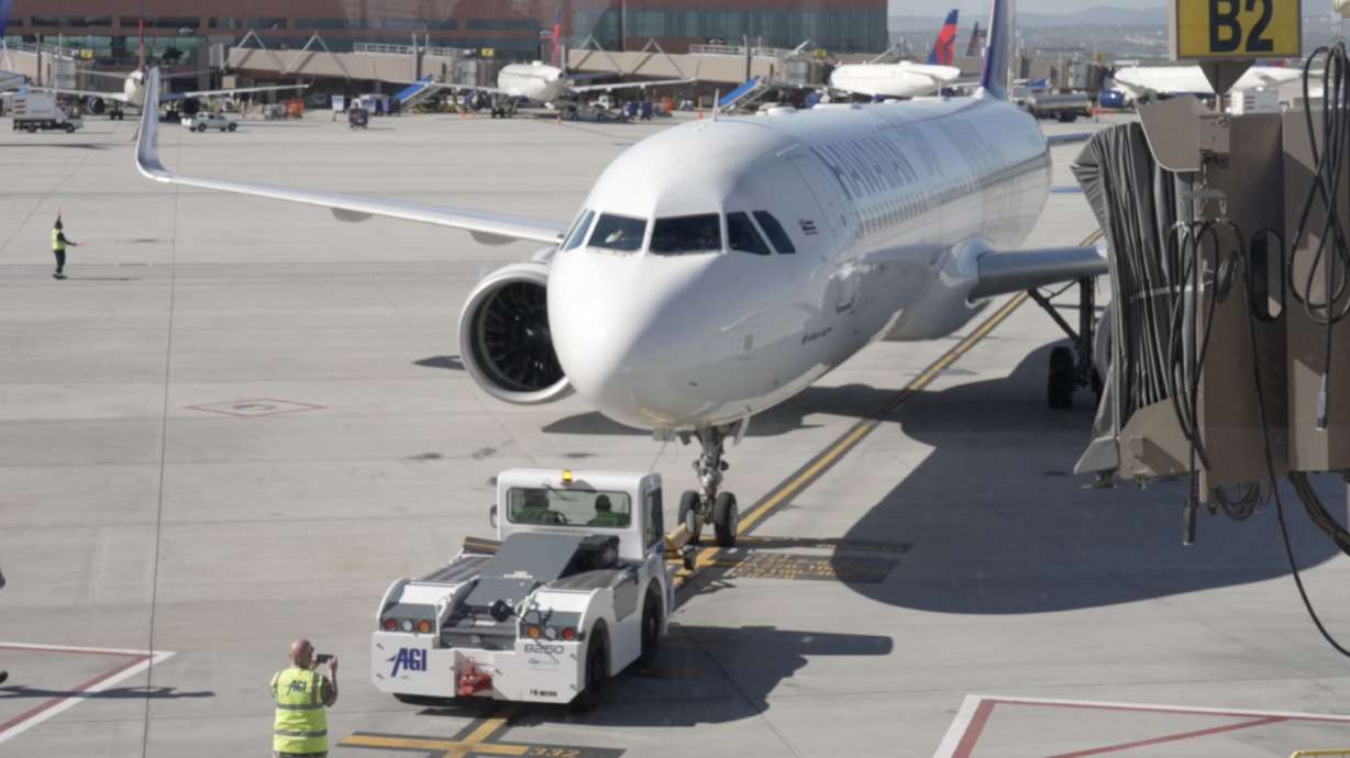 A Hawaiian Airlines airplane departs a gate at Salt Lake City International Airport for Honolulu on Thursday. The airline now offers daily service between the two cities.