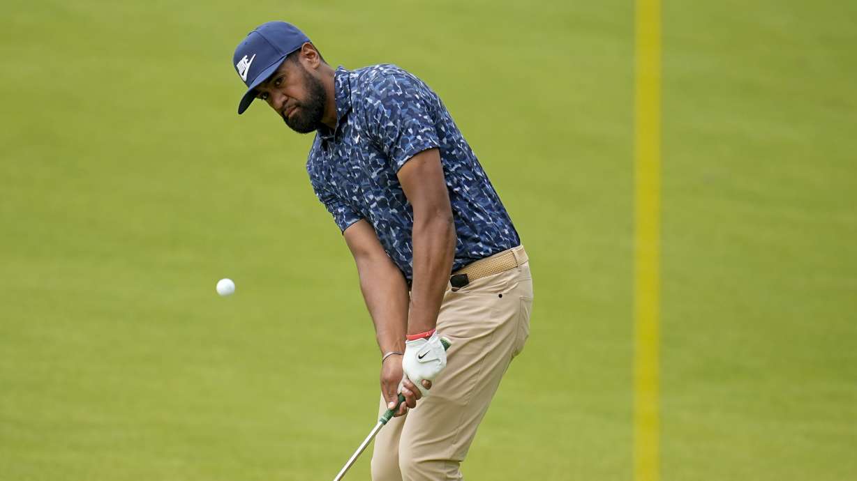 Tony Finau chips to the green on the fourth hole during the first round of the PGA Championship golf tournament at the Valhalla Golf Club, Thursday, May 16, 2024, in Louisville, Ky.