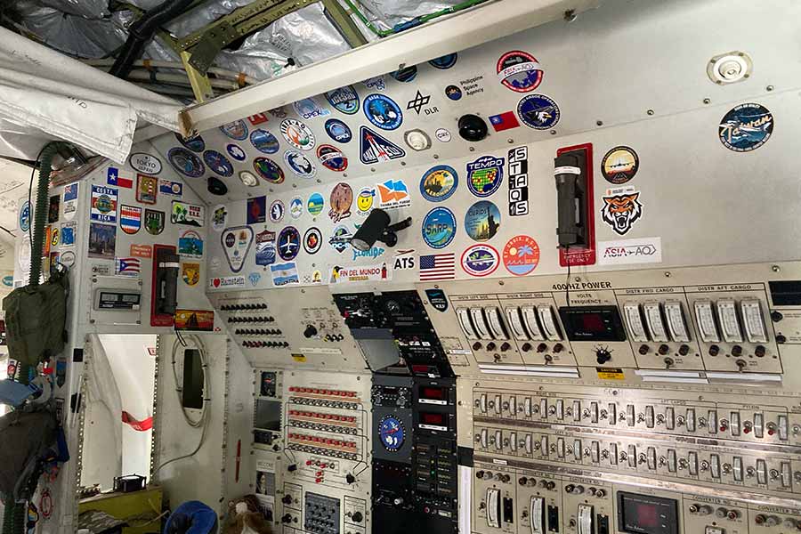 An Idaho State University sticker is placed next to other stickers acquired during the plane's years of operation.