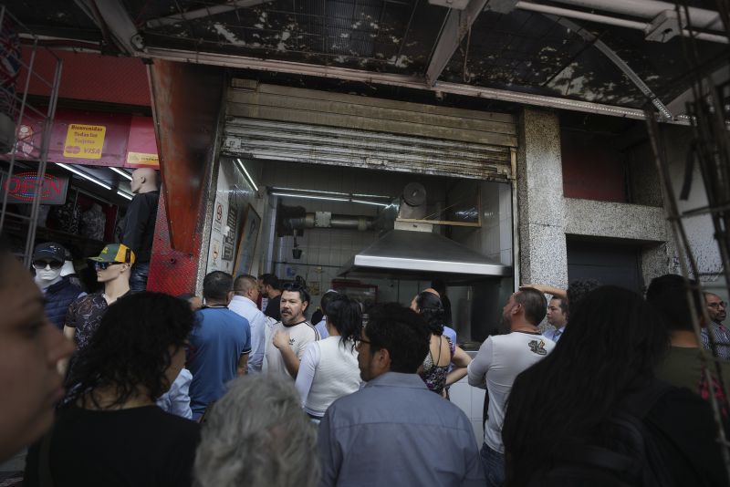 Customers line up to order at the Tacos El Califa de León taco stand, in Mexico City, Wednesday. Tacos El Califa de León is the first ever taco stand to receive a Michelin star.