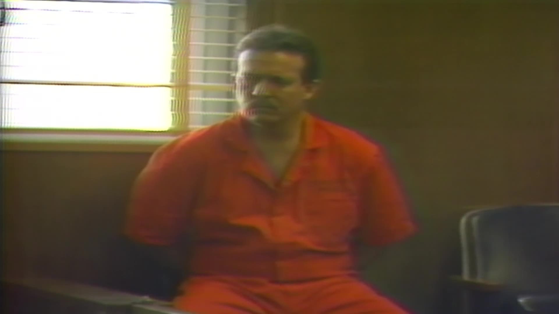 Cary Hartmann in handcuffs in 1987.