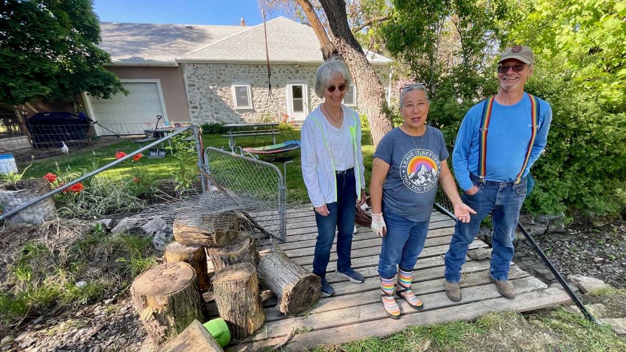 Anna Keogh, Tammy Creeger and Creeger's husband Rick Creeger stand in the backyard of the Creeger home in Ogden on Thursday. They've helped spearhead efforts to preserve the history of the Bingham Fort neighborhood.