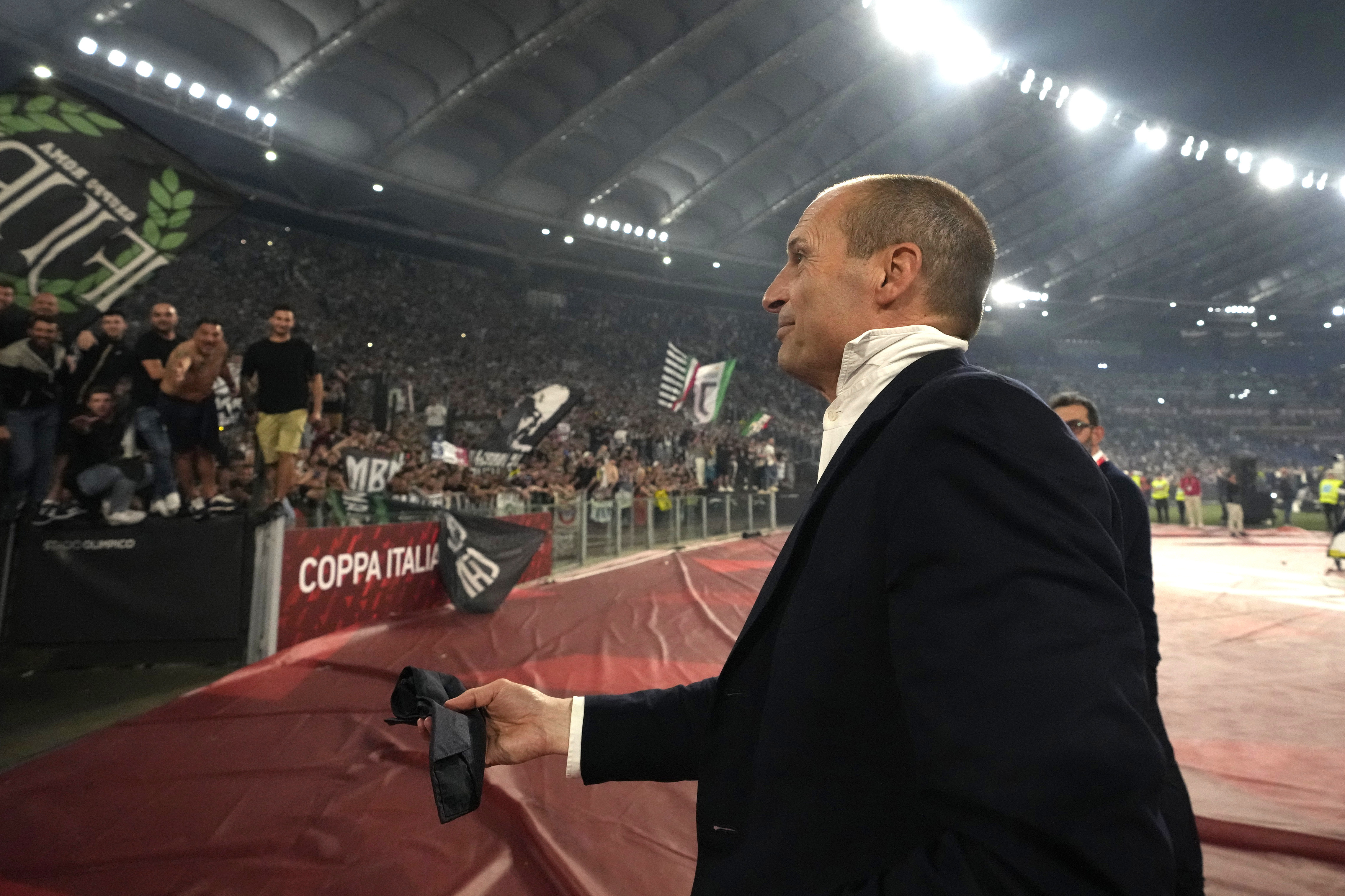 Juventus' head coach Massimiliano Allegri holds his tie at the end of the Italian Cup final soccer match between Atalanta and Juventus at Rome's Olympic Stadium, Wednesday, May 15, 2024. Juventus beat Atalanta 1-0.