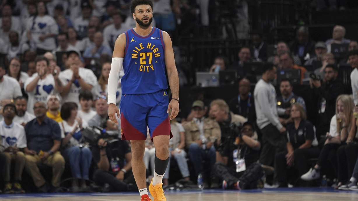 Denver Nuggets guard Jamal Murray walks on the court during the first half of Game 6 of the team's NBA basketball second-round playoff series against the Minnesota Timberwolves, Thursday, May 16, 2024, in Minneapolis.