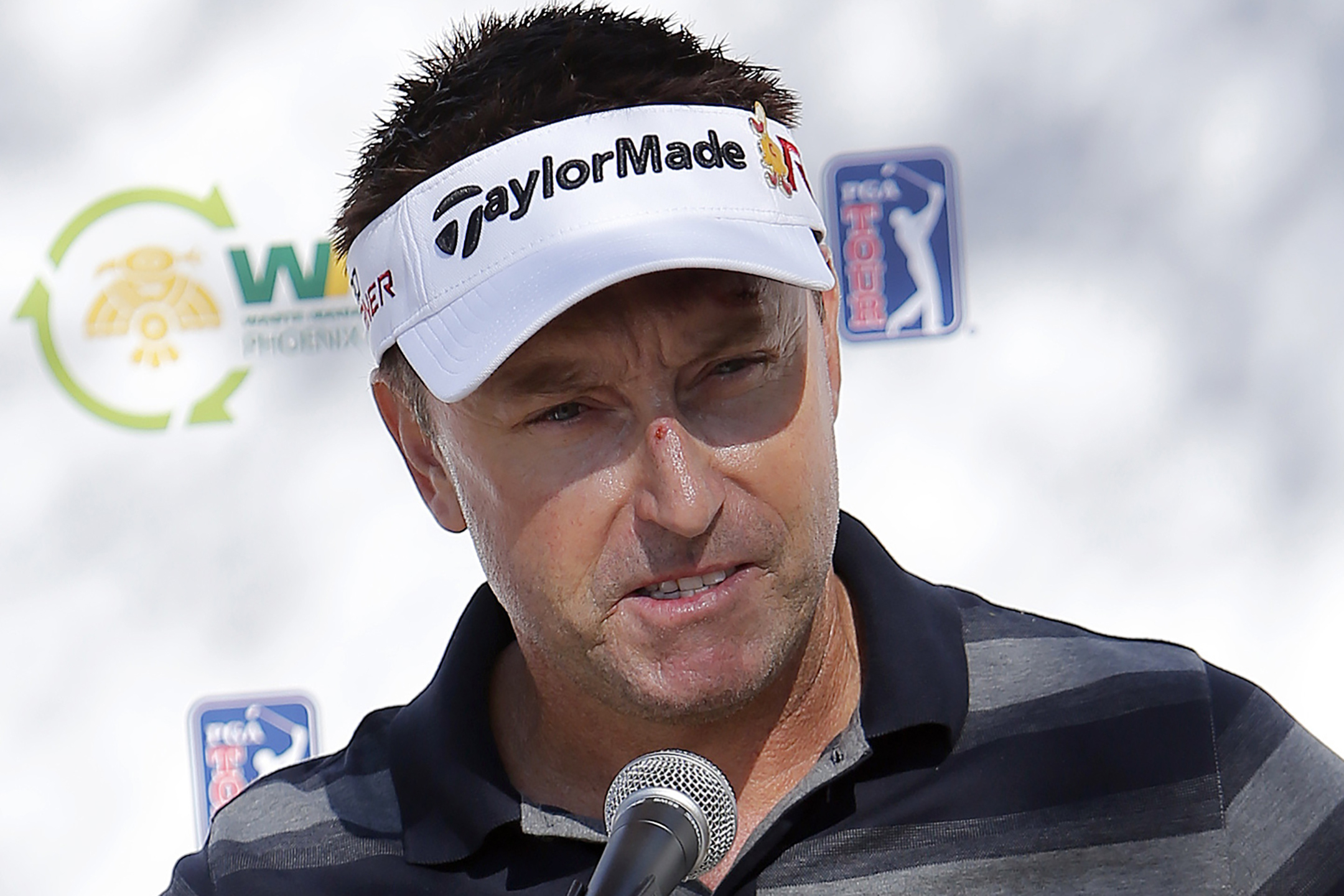 FILE - Robert Allenby, of Australia, talks to the media at a practice round for the Phoenix Open golf tournament, Tuesday, Jan. 27, 2015, in Scottsdale, Ariz. Scottie Scheffler's arrest hours before his second-round tee time at the PGA Championship in Louisville will go down as one of the most shocking in professional golf history. It certainly wasn't the first, though. Allenby was arrested outside of a casino in Rock Island, Illinois, hours after he missed the cut in the 2016 John Deere Classic.