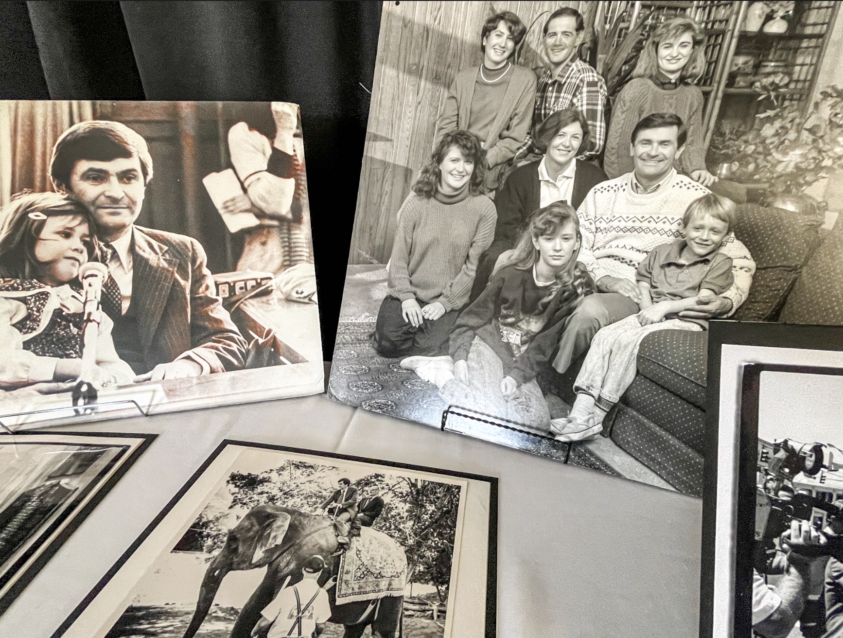 Photos of Ted Wilson and his family are displayed at a memorial service for the former Salt Lake City mayor on Friday.