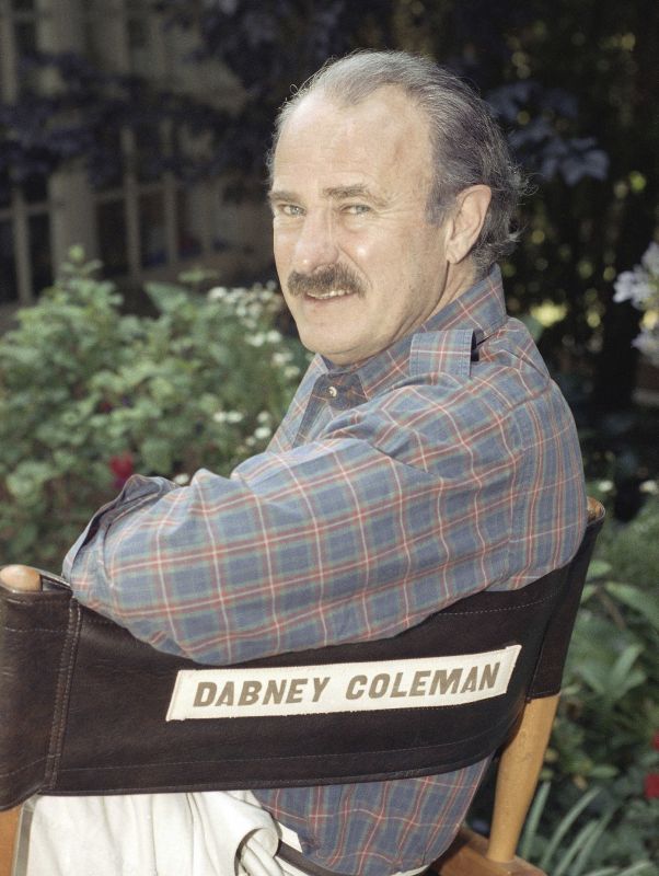 Actor Dabney Coleman poses at his home in Brentwood, Calif., Sept. 8, 1991. Coleman, the mustachioed character actor who specialized in smarmy villains died Thursday 2024, his daughter, Quincy Coleman, told The Hollywood Reporter. He was 92.