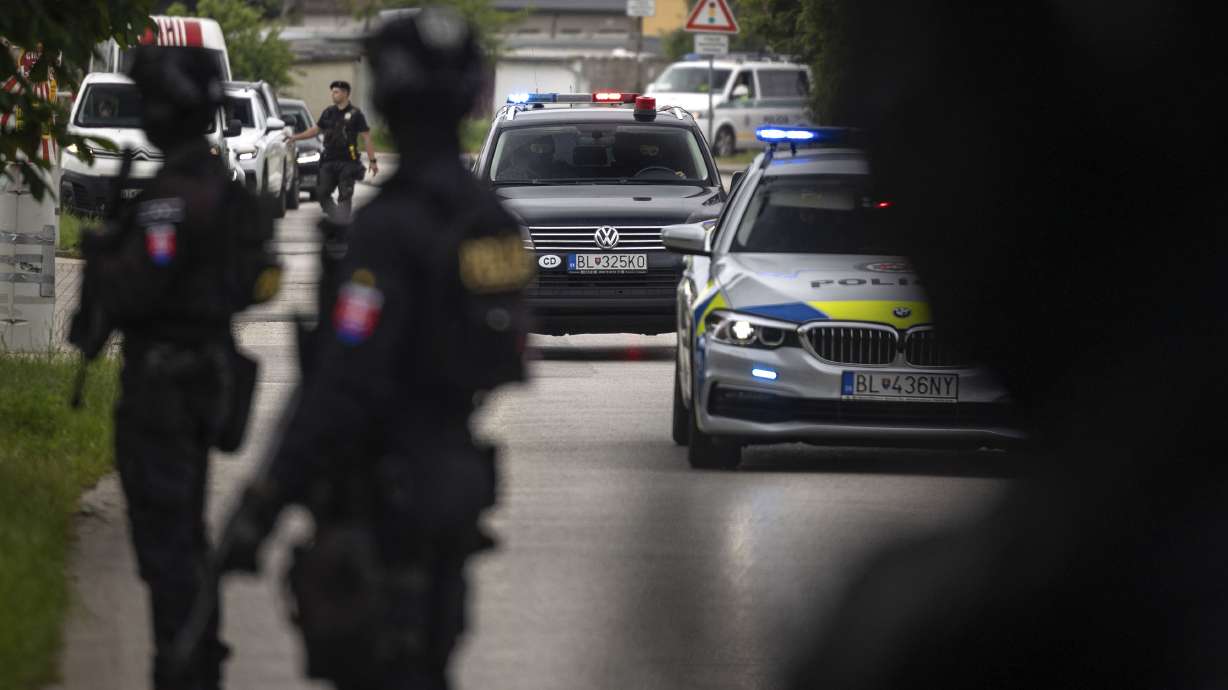 Police guard the area as a shooting suspect of Slovakia's Prime Minister Robert Fico, is taken to court in Pezinok, Slovakia, Saturday. Officials say Fico remains in serious condition.