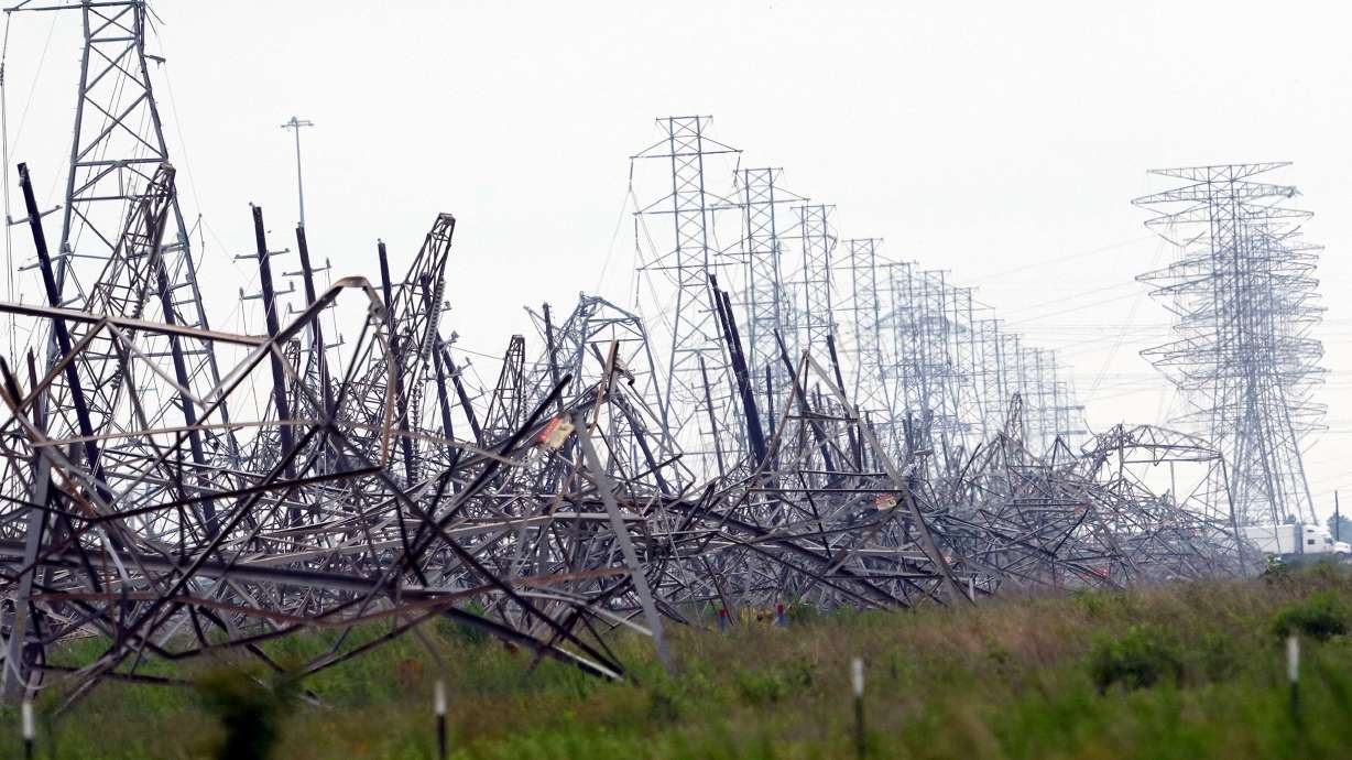 Down power lines are shown in the aftermath of a severe thunderstorm in Cypress, Texas, near Houston on Friday.