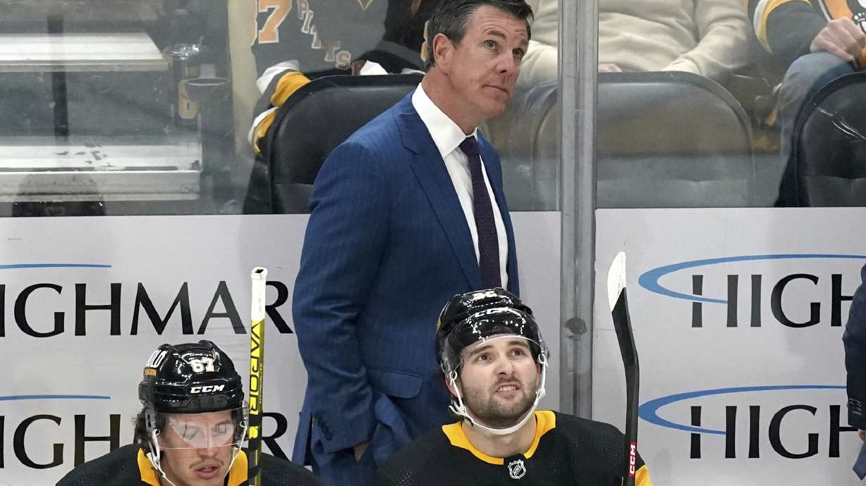 FILE - Pittsburgh Penguins head coach Mike Sullivan stands behind his bench during the first period of an NHL hockey game against the Nashville Predators, Monday, April 15, 2024, in Pittsburgh. Sullivan has been named U.S. coach for the 2026 Milan Olympics. USA Hockey announced the long-expected decision Saturday, May 18 while also saying the Pittsburgh Penguins coach will be behind the bench for the NHL's Four Nations Face-Off tournament next year.