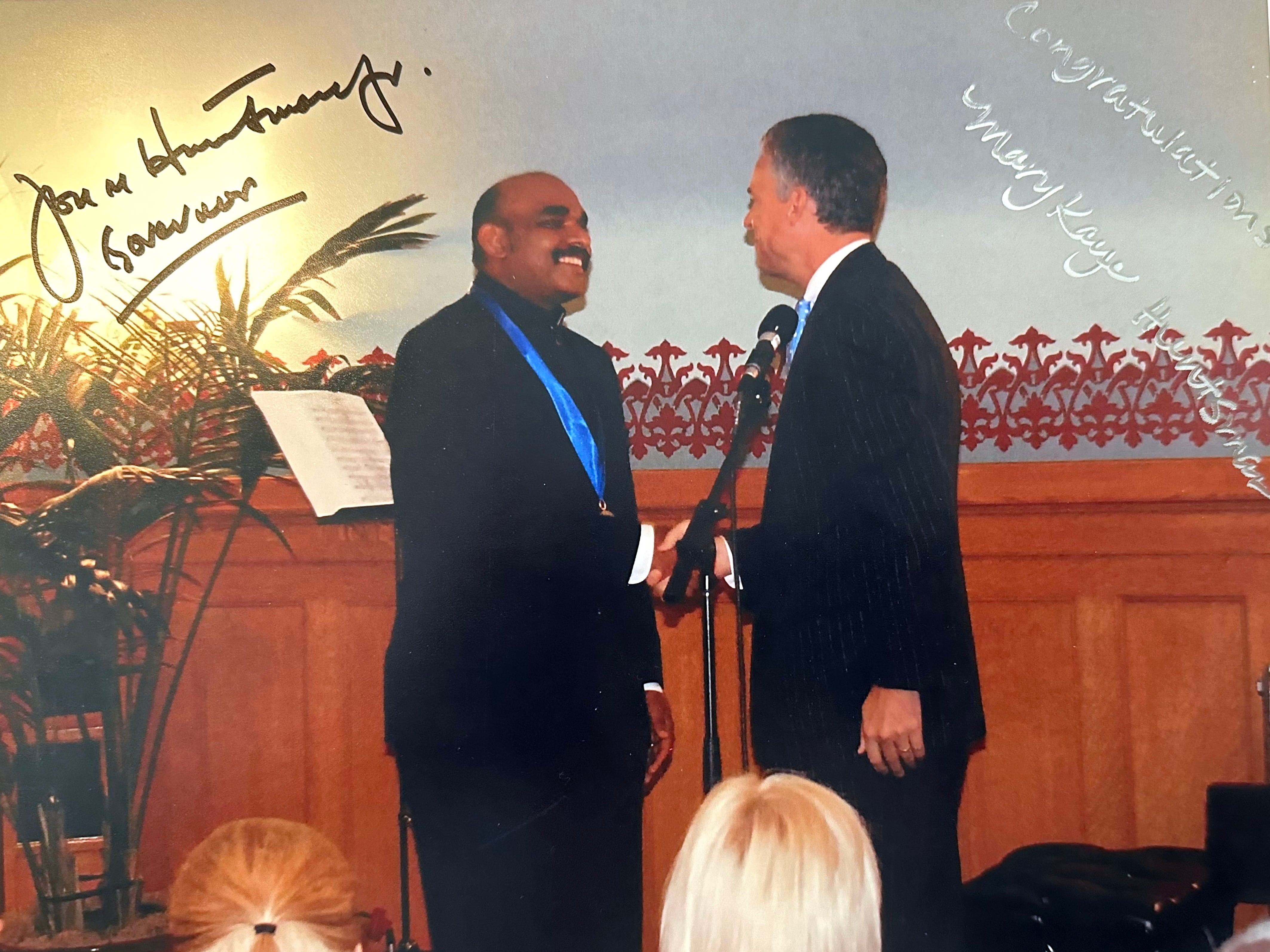 Emmanuel Shanthakumar, chef and owner of Royal India, shaking hands with former Utah Gov. Jon Huntsman Jr. at the Artist Awards on Sept. 19, 2007. Shanthakumar received a governor's medal. The photo is signed by Huntsman and former first lady of Utah Mary Kaye Huntsman.