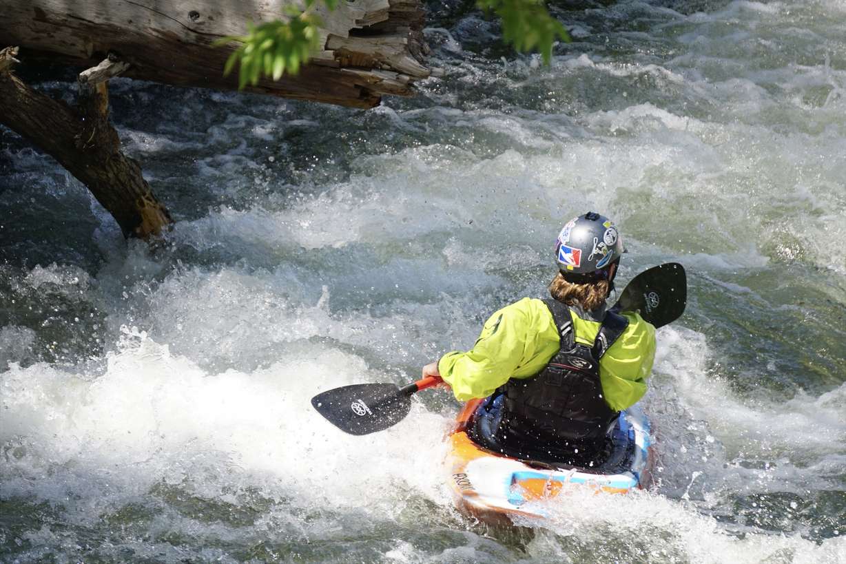 A whitewater kayaker races down the Provo River on Saturday.