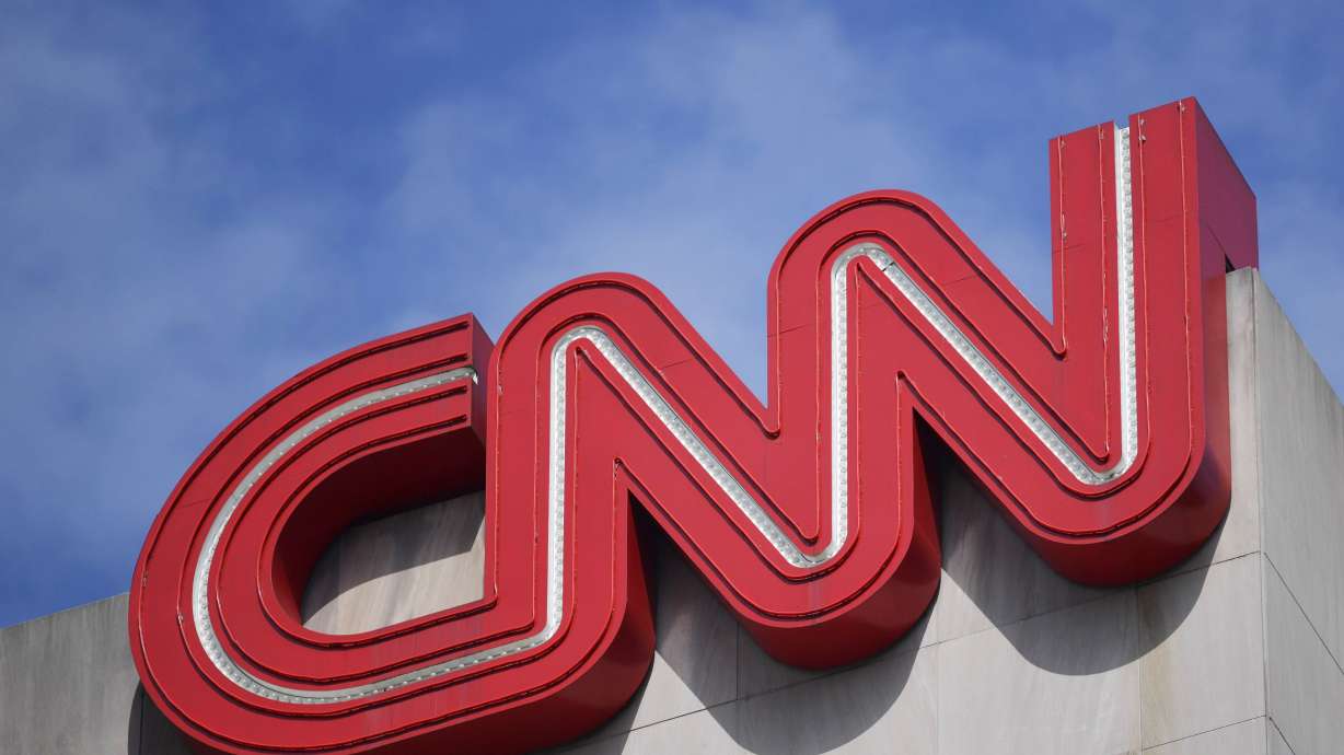 Signage hangs at CNN center, April 21, 2022, in Atlanta. Alice Stewart, a CNN political commentator and veteran political adviser who worked on a number of GOP presidential campaigns, has died at age 58, the news network reported Saturday.