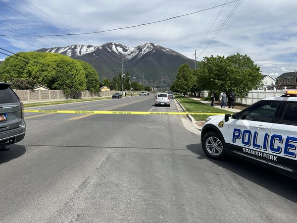 Police investigate the scene where two teenage girls were hit by an SUV in Spanish Fork on May 18.