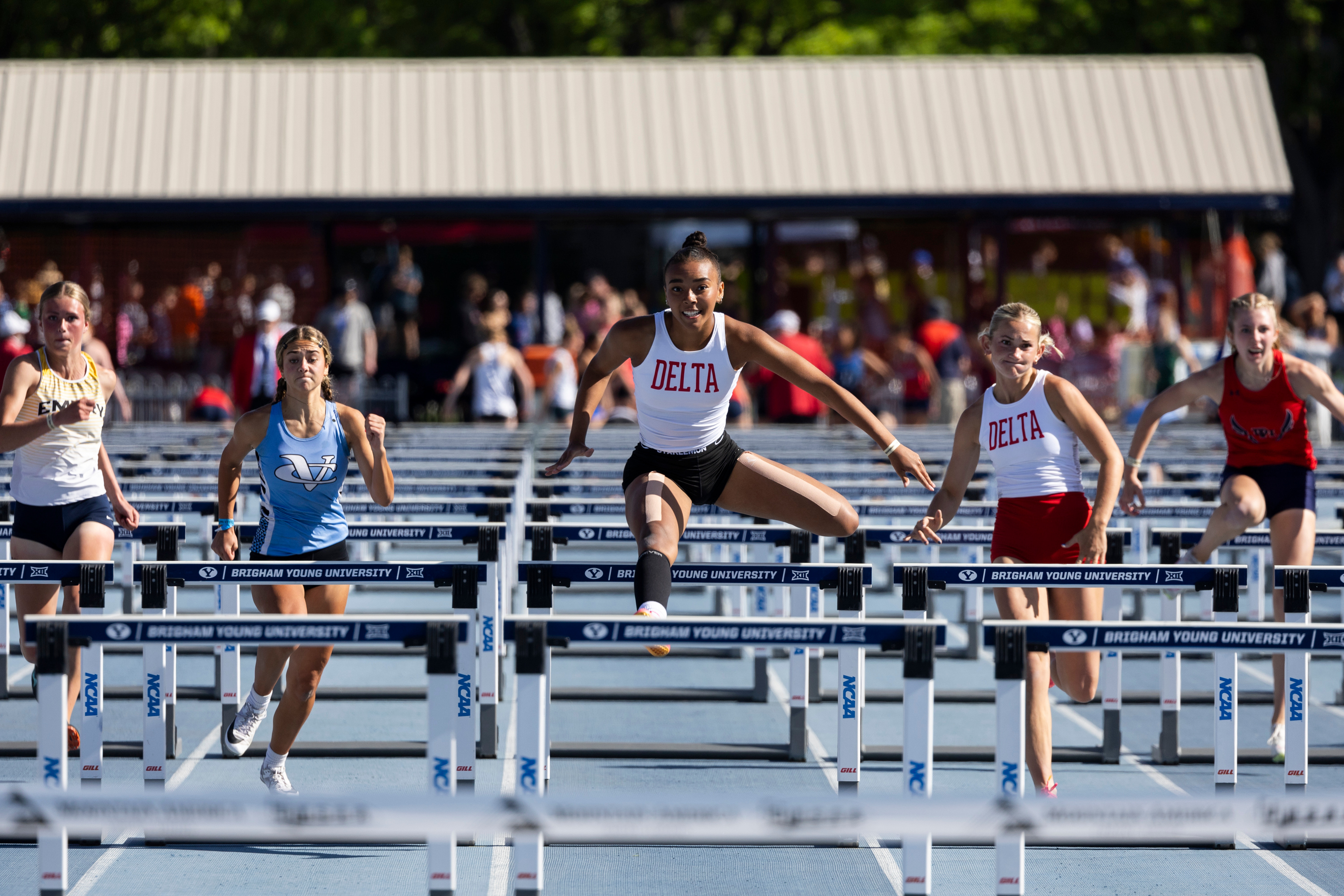 A runner from Delta competes in the 100-meter hurdles during the final day of the 3A Utah state track meet at the Track and Field Complex in Provo on Saturday, May 18, 2024.
