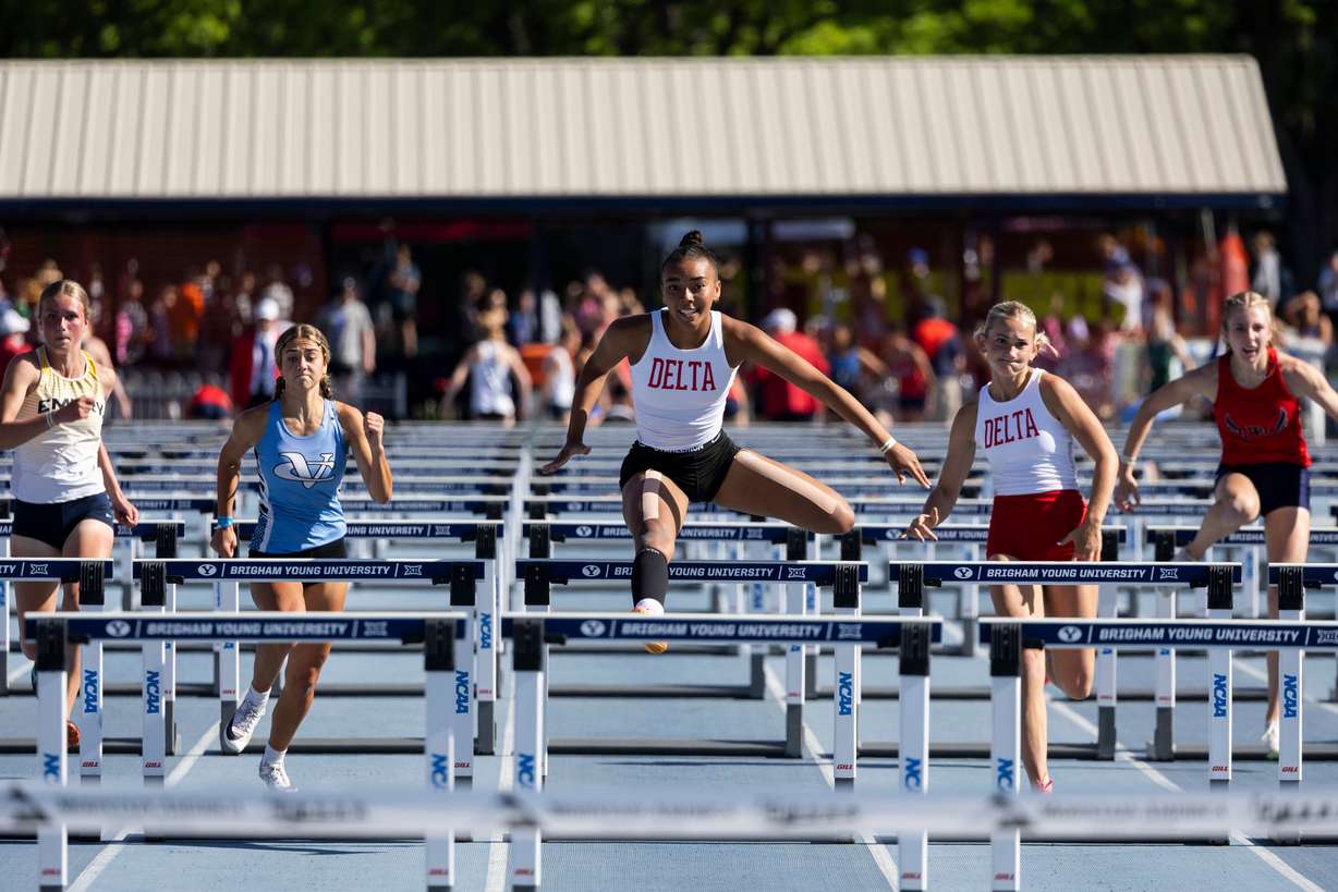 A runner from Delta competes in the 100-meter hurdles during the final day of the 3A Utah state track meet at the Track and Field Complex in Provo on Saturday, May 18, 2024.