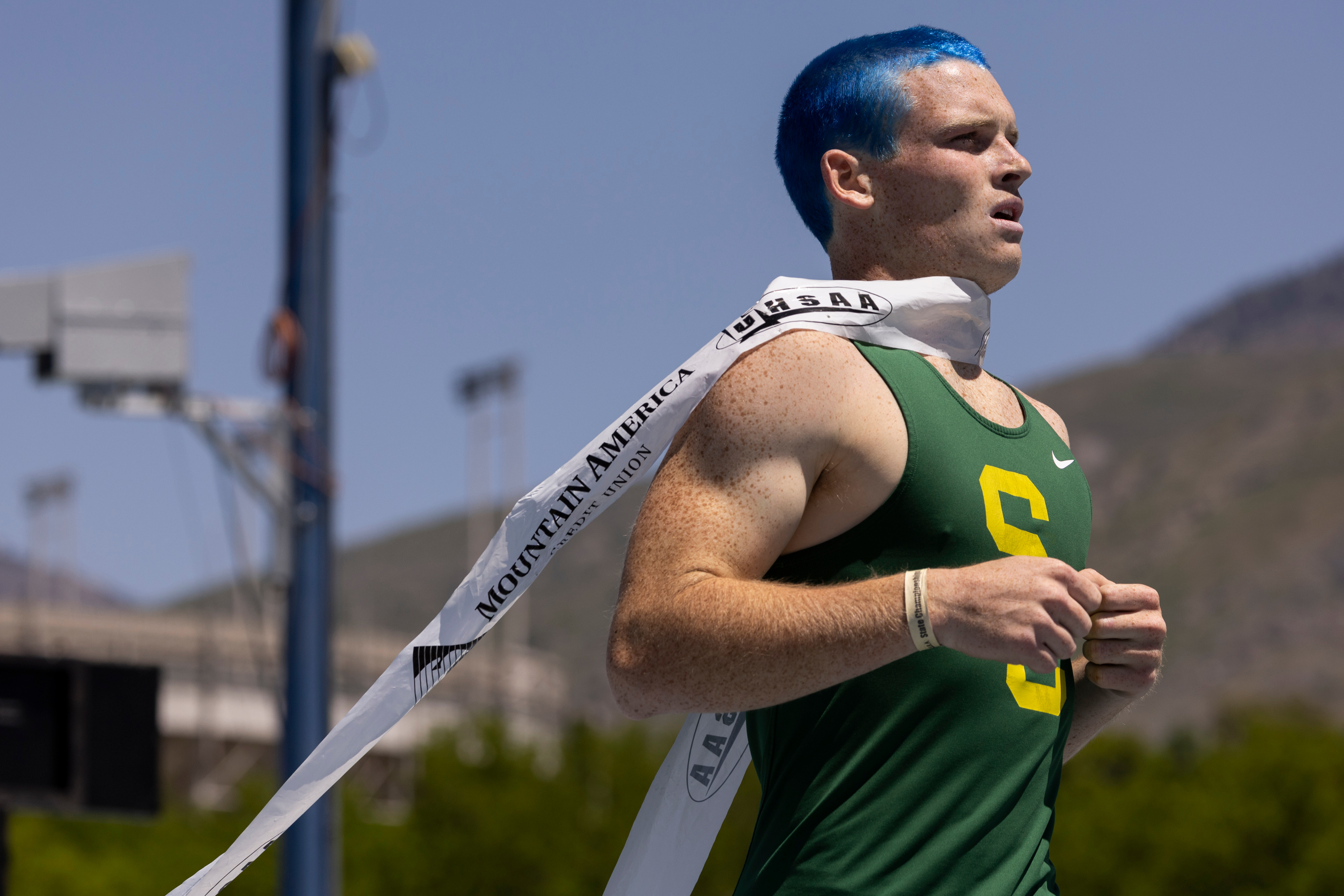 A runner from Snow Canyon crosses the finish line during the final day of the 4A Utah state track meet at the Track and Field Complex in Provo on Saturday, May 18, 2024.