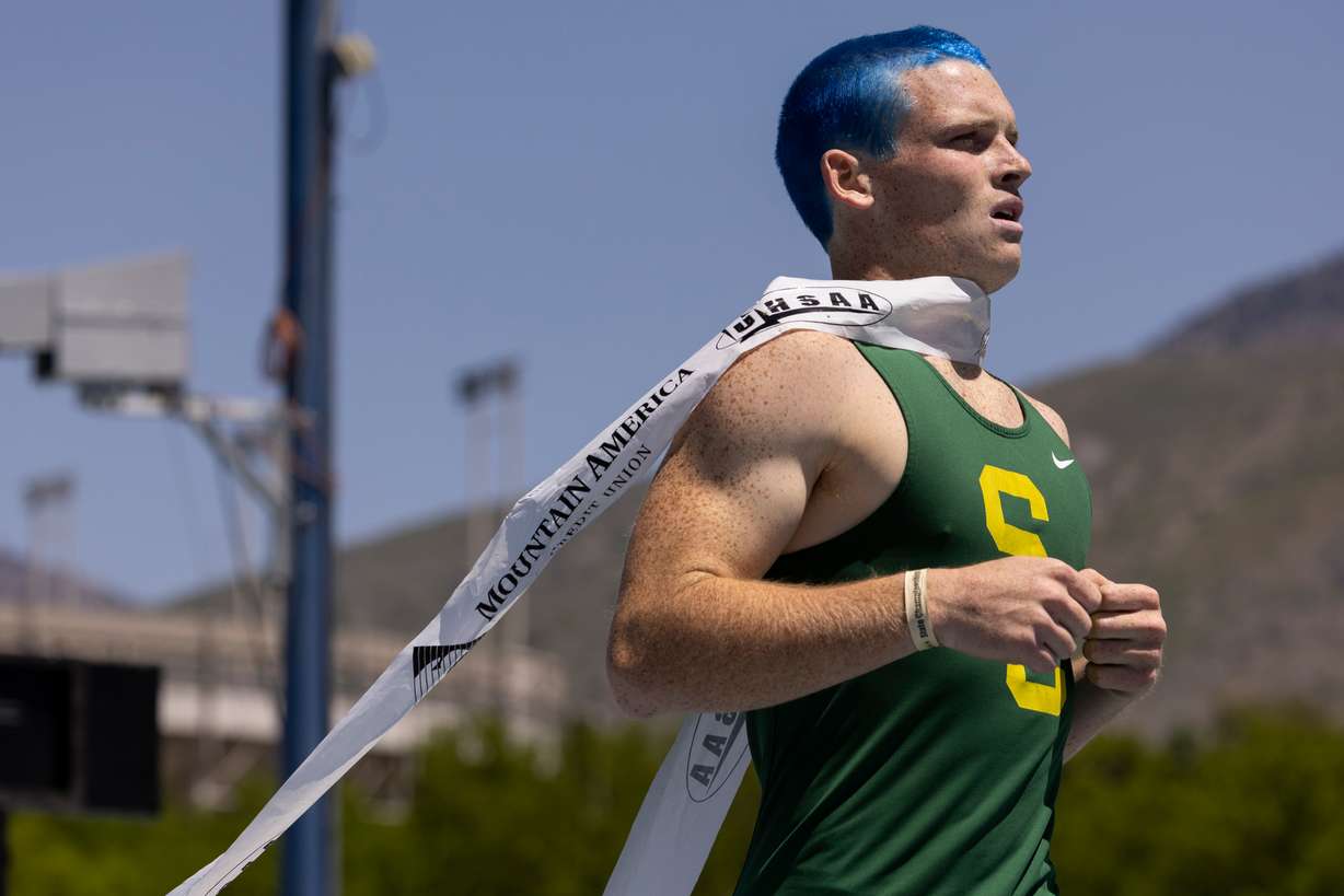 A runner from Snow Canyon crosses the finish line during the final day of the 4A Utah state track meet at the Track and Field Complex in Provo on Saturday, May 18, 2024.