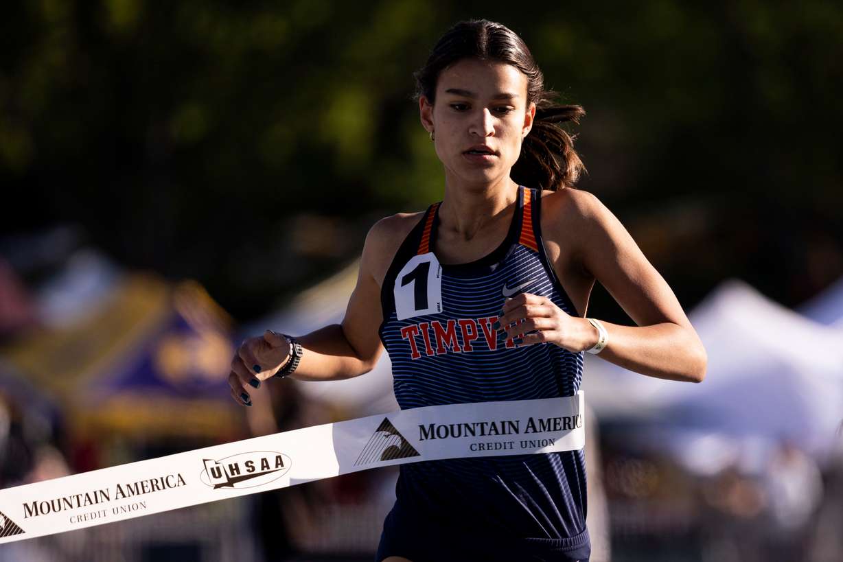 A Timpview runner crosses the finish line during the final day of 5A Utah state track meet at the Track and Field Complex in Provo, on Saturday May 18, 2024.