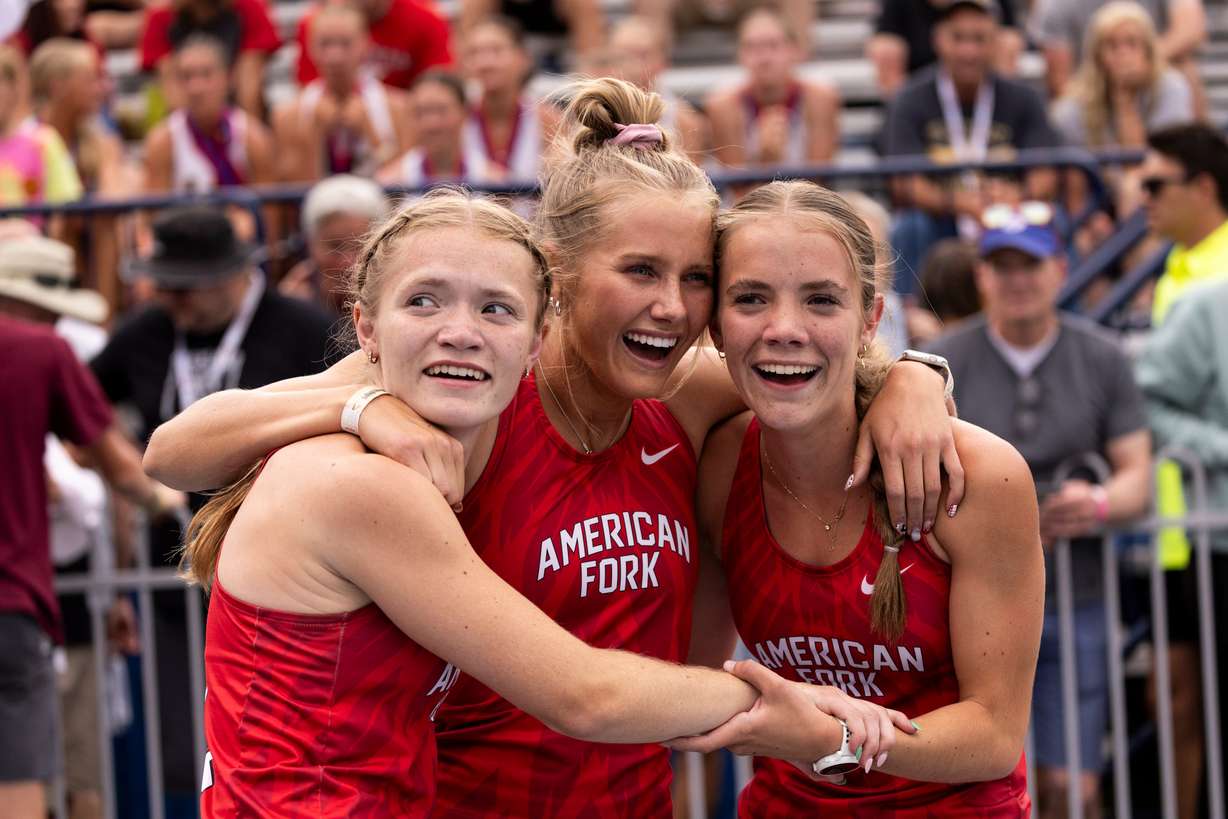 American Fork runners celebrate near the finish line during the final day of a Utah state track meet at Track and Field Complex in Provo, on Saturday May 18, 2024.