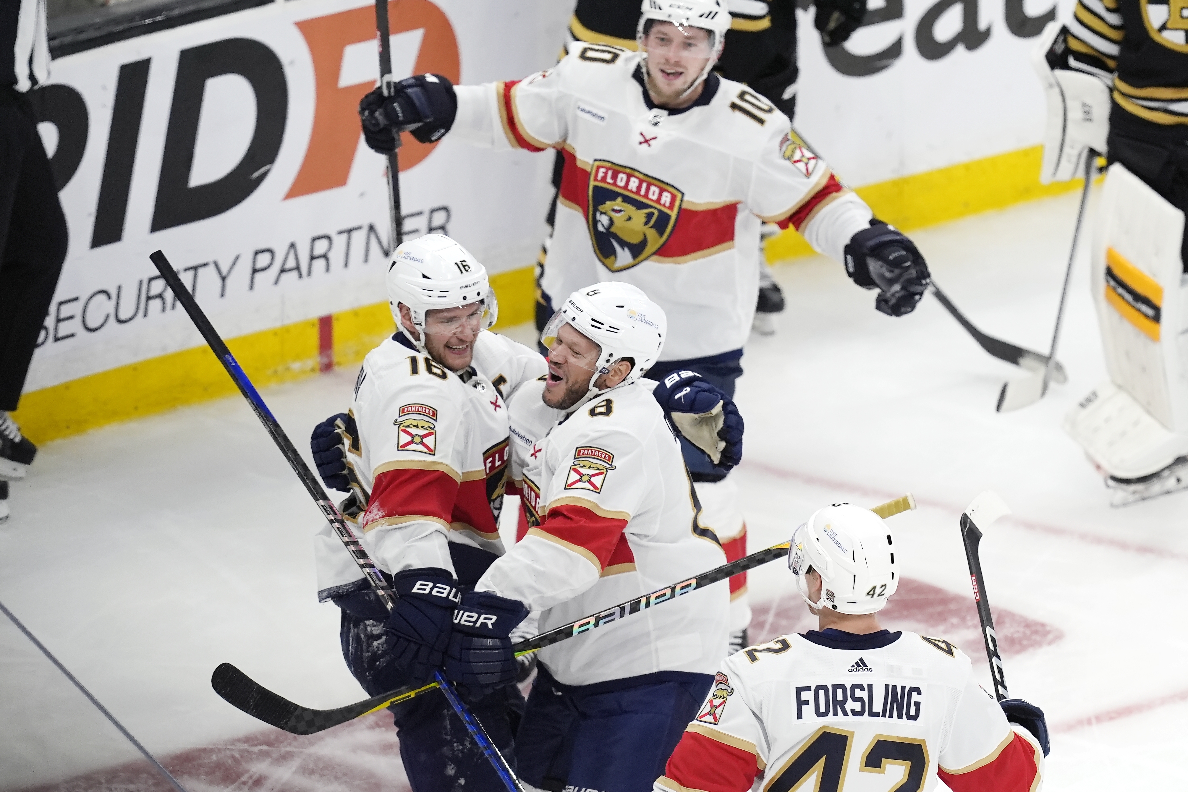 Florida Panthers' Aleksander Barkov (16) celebrates after his goal with Kyle Okposo (8), Gustav Forsling (42) and Vladimir Tarasenko (10) during the third period in Game 4 of an NHL hockey Stanley Cup second-round playoff series against the Boston Bruins, Sunday, May 12, 2024, in Boston. 