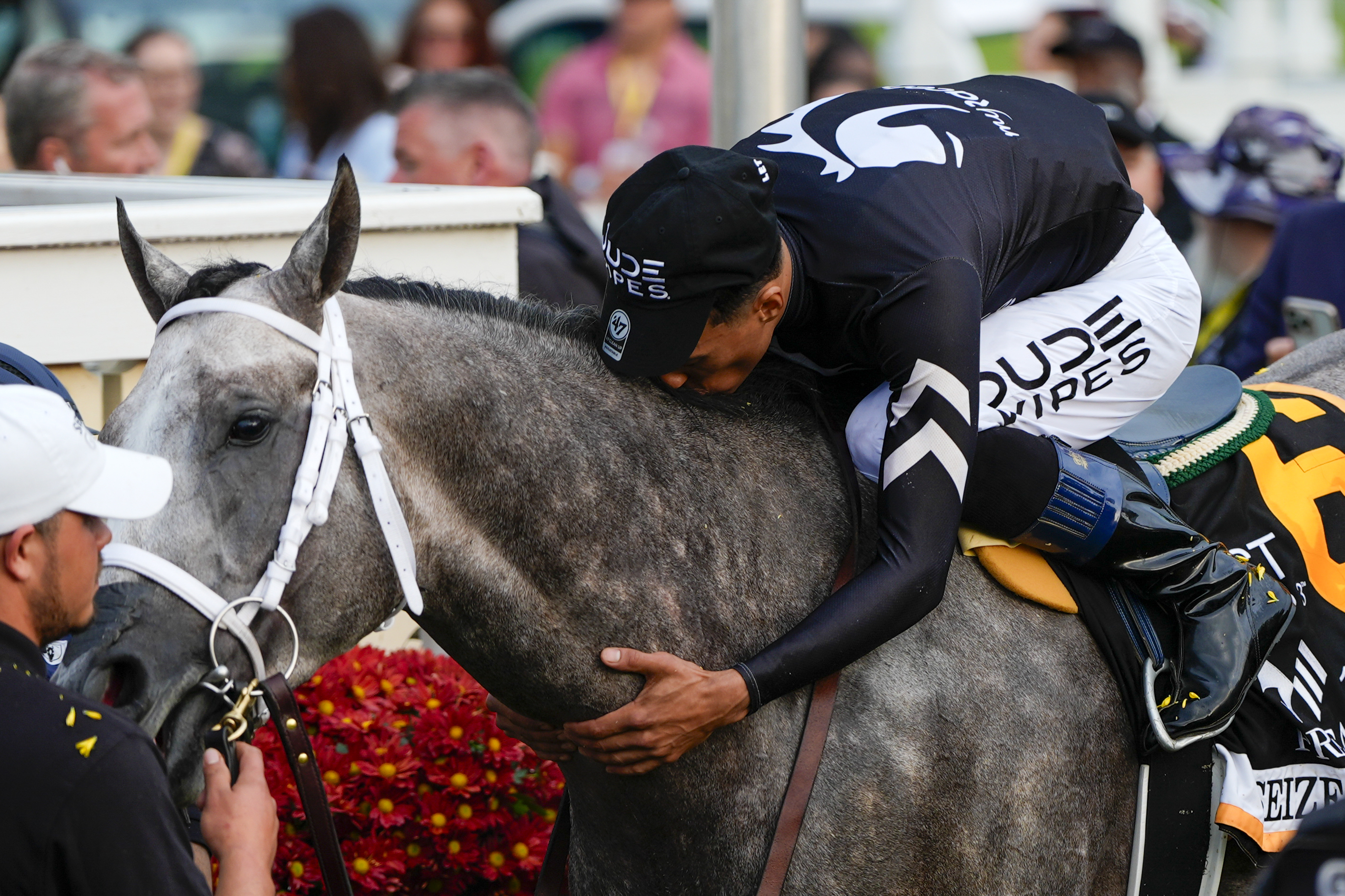 Jaime Torres kisses Seize The Grey after they won the Preakness Stakes horse race at Pimlico Race Course, Saturday, May 18, 2024, in Baltimore.