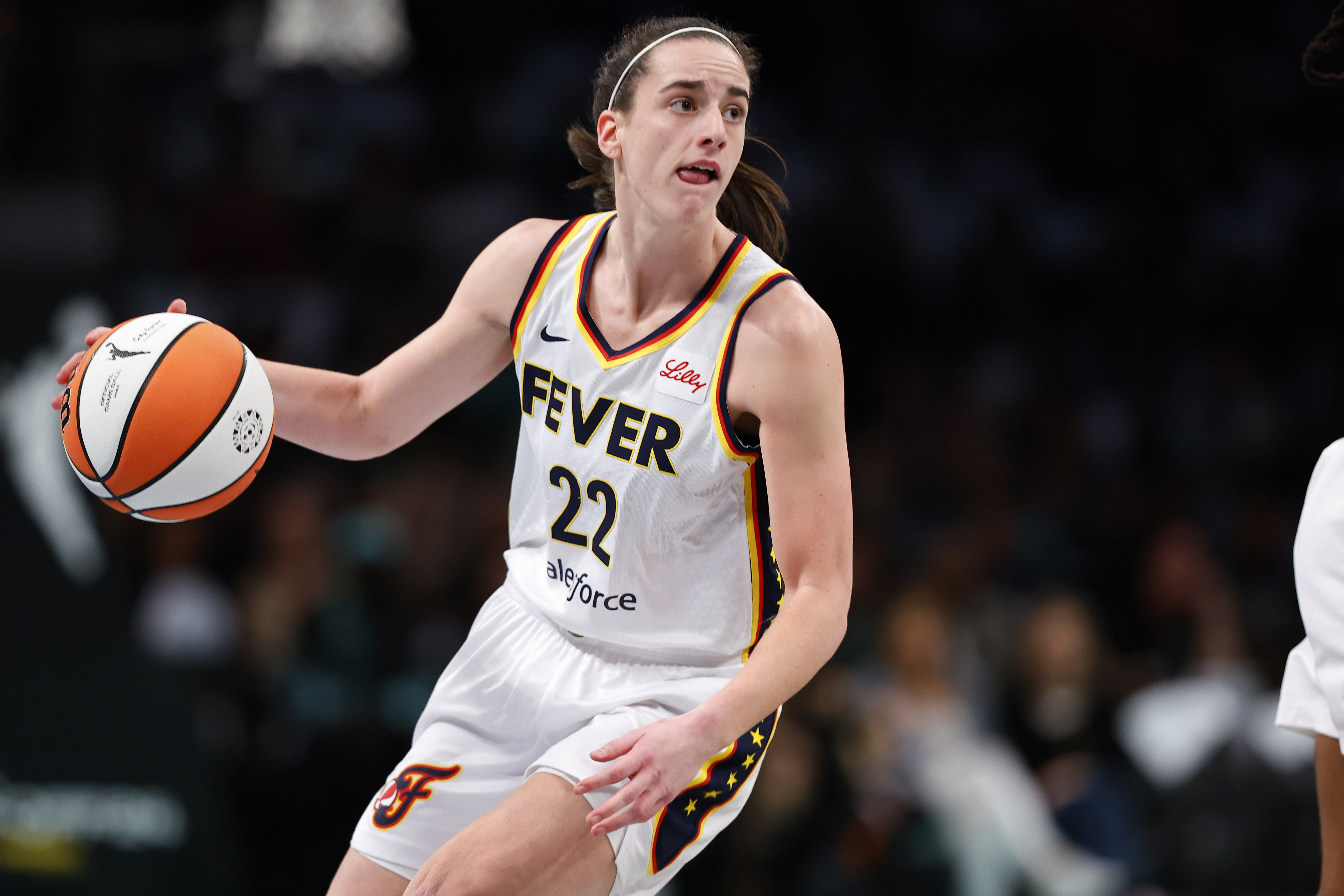 Indiana Fever guard Caitlin Clark (22) dribbles the ball against the New York Liberty during the first half of a WNBA basketball game, Saturday, May 18, 2024, in New York. 
