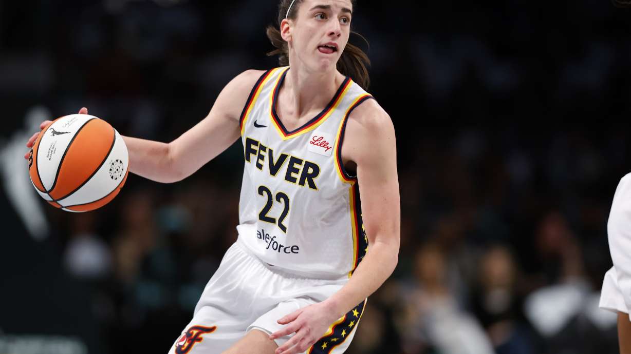 Indiana Fever guard Caitlin Clark (22) dribbles the ball against the New York Liberty during the first half of a WNBA basketball game, Saturday, May 18, 2024, in New York.