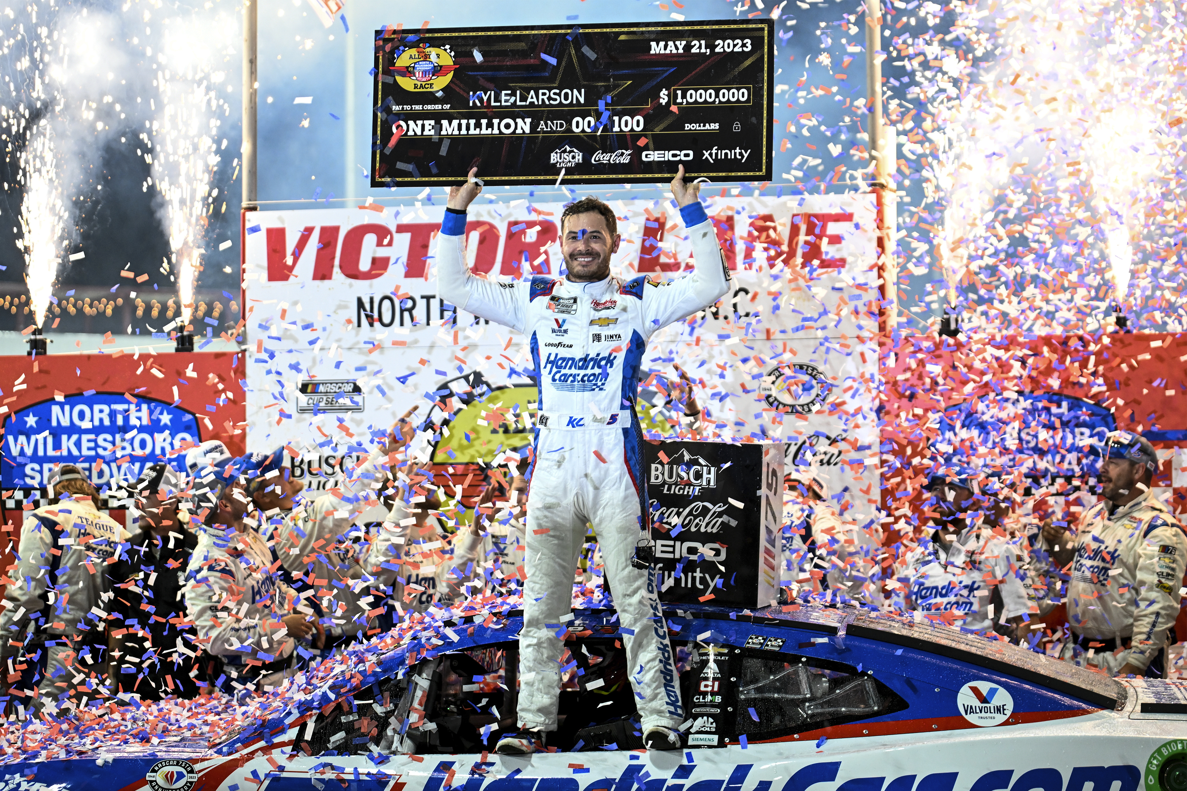 FILE - Kyle Larson (5) celebrates in Victory Lane after winning the NASCAR All-Star Cup Series auto race at North Wilkesboro Speedway, Sunday, May 21, 2023, in North Wilkesboro, N.C. 