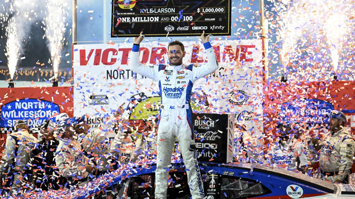 FILE - Kyle Larson (5) celebrates in Victory Lane after winning the NASCAR All-Star Cup Series auto race at North Wilkesboro Speedway, Sunday, May 21, 2023, in North Wilkesboro, N.C.