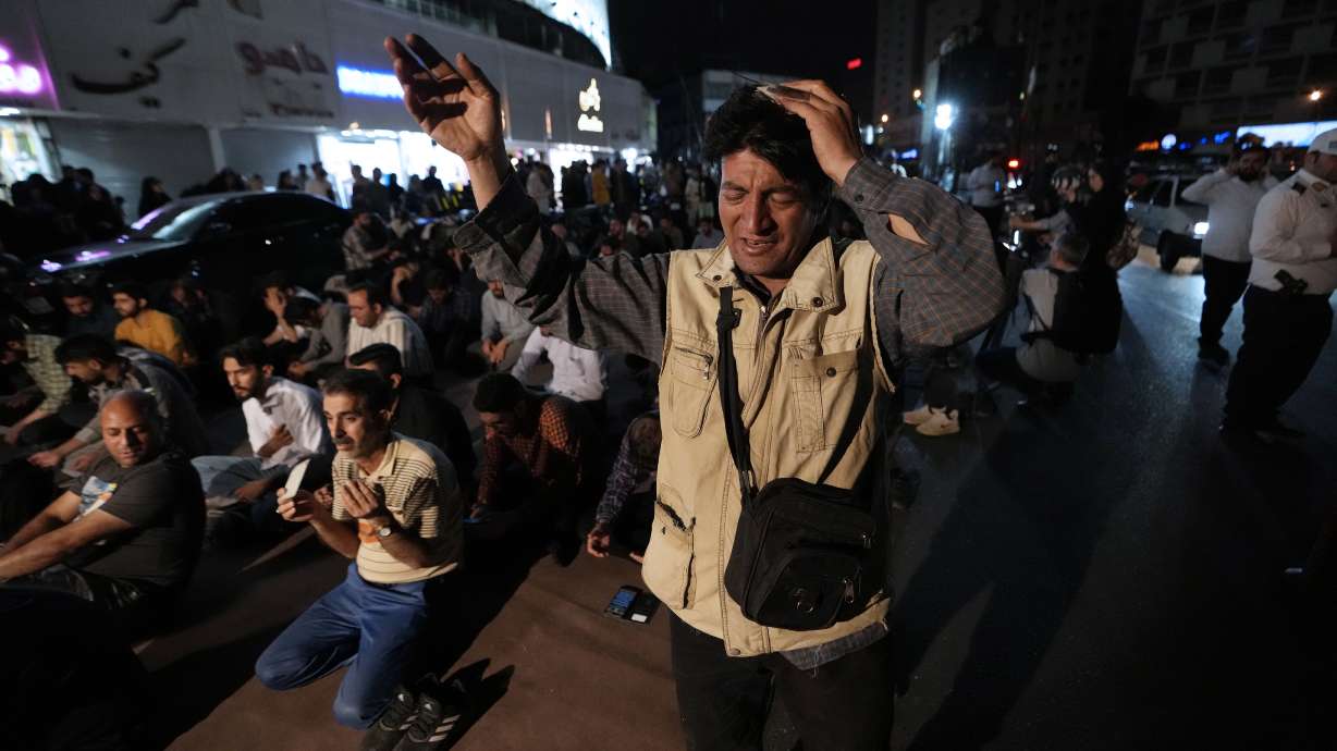 People pray for President Ebrahim Raisi at a ceremony at Vali-e-Asr square in downtown Tehran, Iran, Sunday. A helicopter carrying President Raisi, the country's foreign minister and other officials apparently crashed in the mountainous northwest reaches of Iran on Sunday.