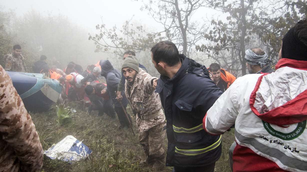 Rescue team members work at the scene of a crash of a helicopter carrying Iranian President Ebrahim Raisi in Varzaghan in northwestern Iran, Monday. Raisi, the country’s foreign minister and several other officials were found dead on Monday, hours after their helicopter crashed in a foggy, mountainous region of the country’s northwest, state media reported.