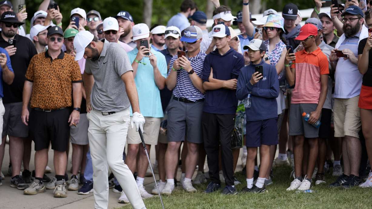 Scottie Scheffler reacts to his chip to the green on the fourth hole during the third round of the PGA Championship golf tournament at the Valhalla Golf Club, Saturday, May 18, 2024, in Louisville, Ky.