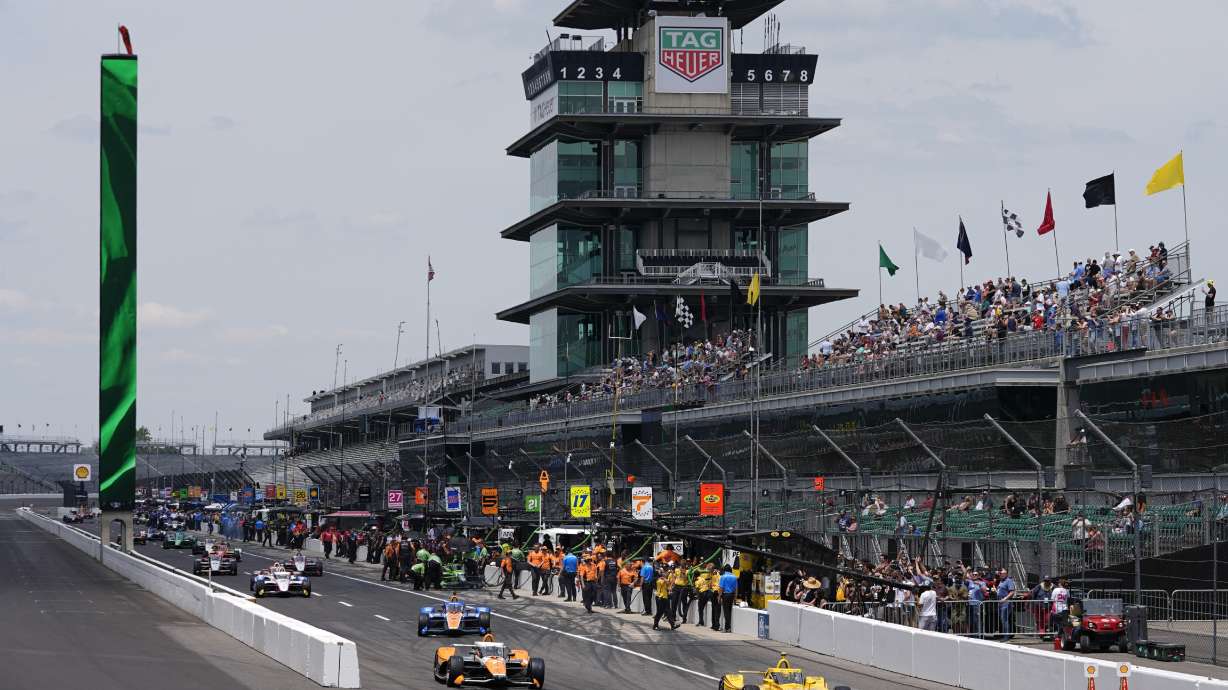 Scott McLaughlin, of New Zealand, leads a group of cars onto the track during a practice session for the Indianapolis 500 auto race at Indianapolis Motor Speedway, Monday, May 20, 2024, in Indianapolis.