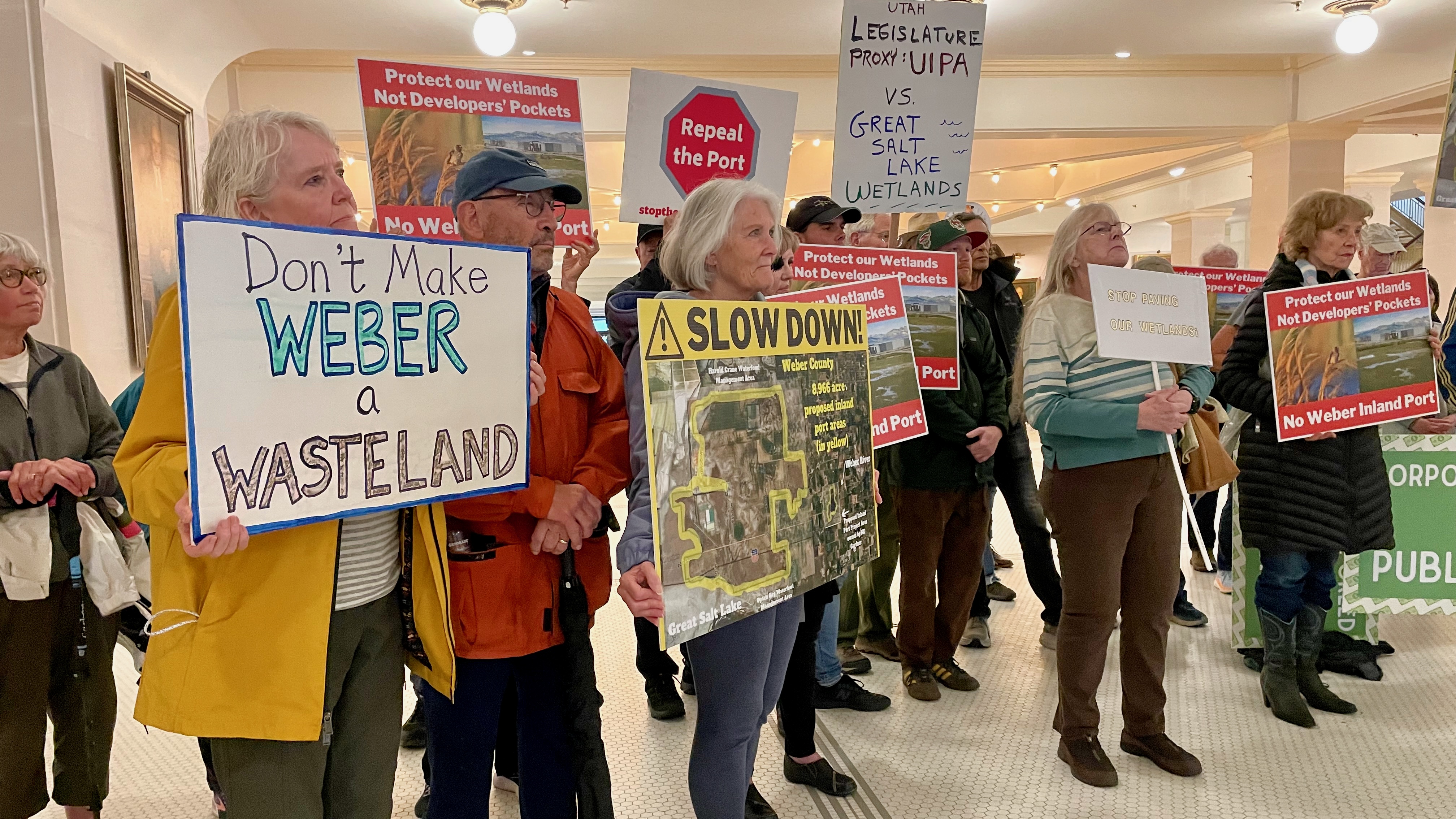 Demonstrators against the proposed Weber County inland port project at a press conference Monday at the Utah Capitol in Salt Lake City.