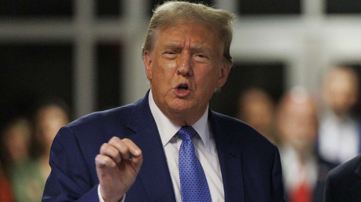 Former President Donald Trump speaks to the media in New York, Monday. A video posted to Trump's account on his social media included references to a "unified Reich."