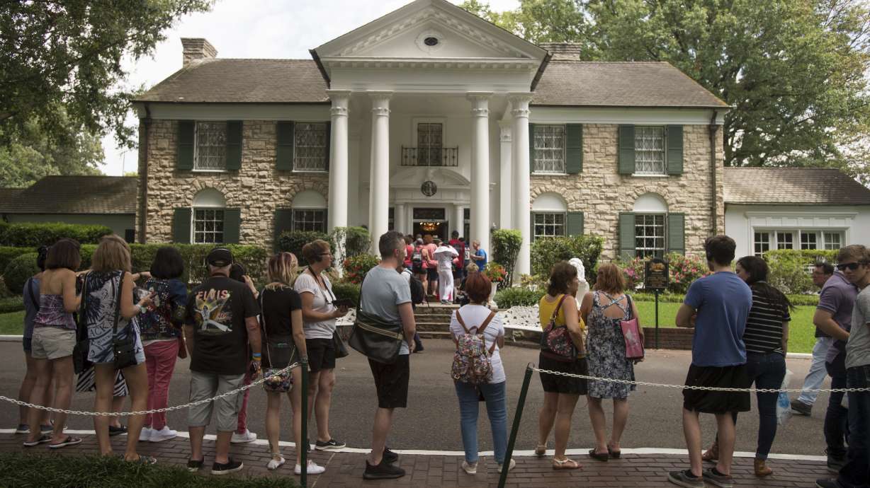 Fans wait in line outside Graceland, Aug. 15, 2017, in Memphis, Tenn. The granddaughter of Elvis Presley is fighting plans to publicly auction his Graceland estate in Memphis after a company tried to sell the property.