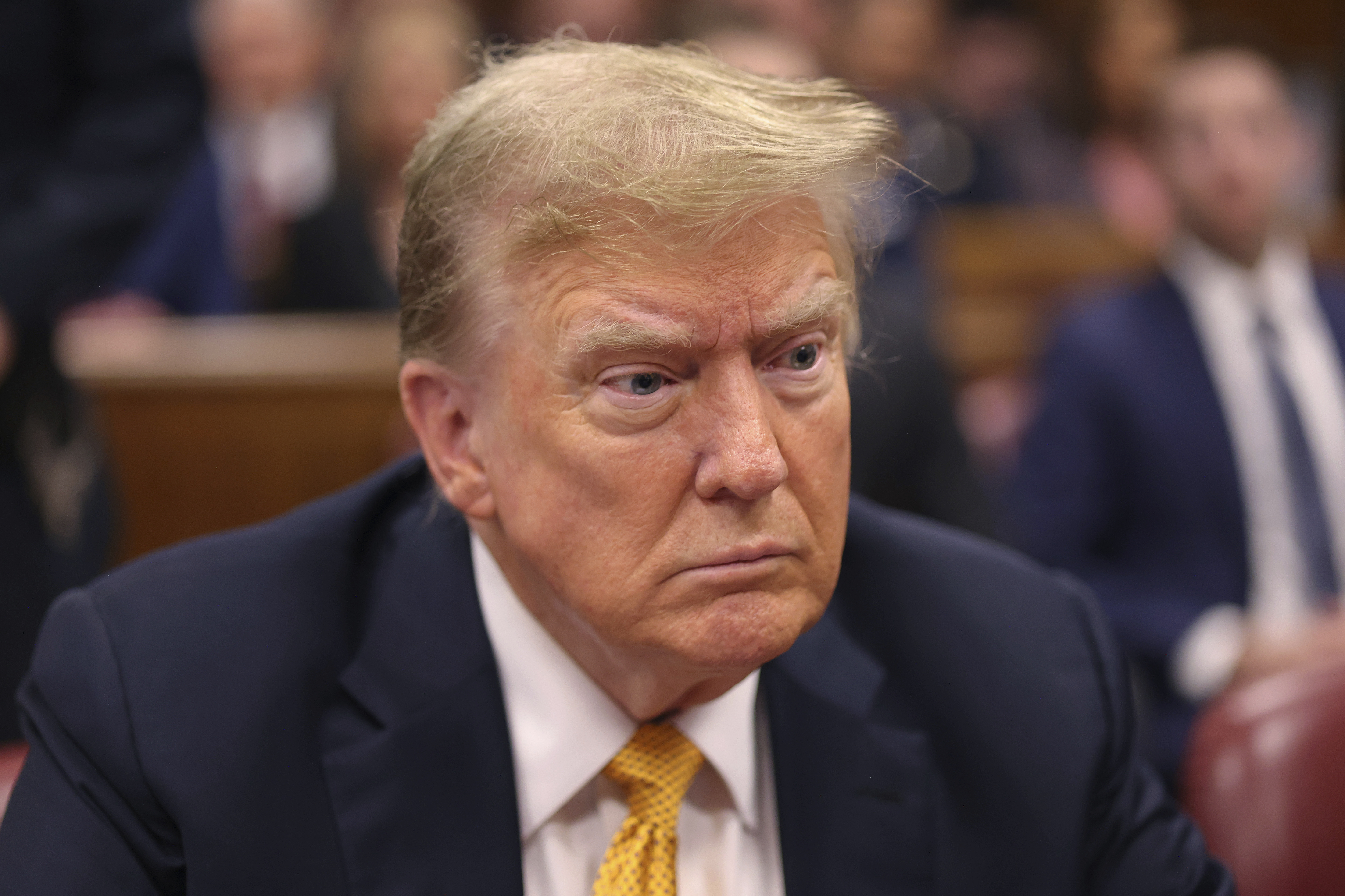 Former President Donald Trump sits in Manhattan Criminal Court on Tuesday in New York. His lawyers on Tuesday rested their case without calling him as a witness.