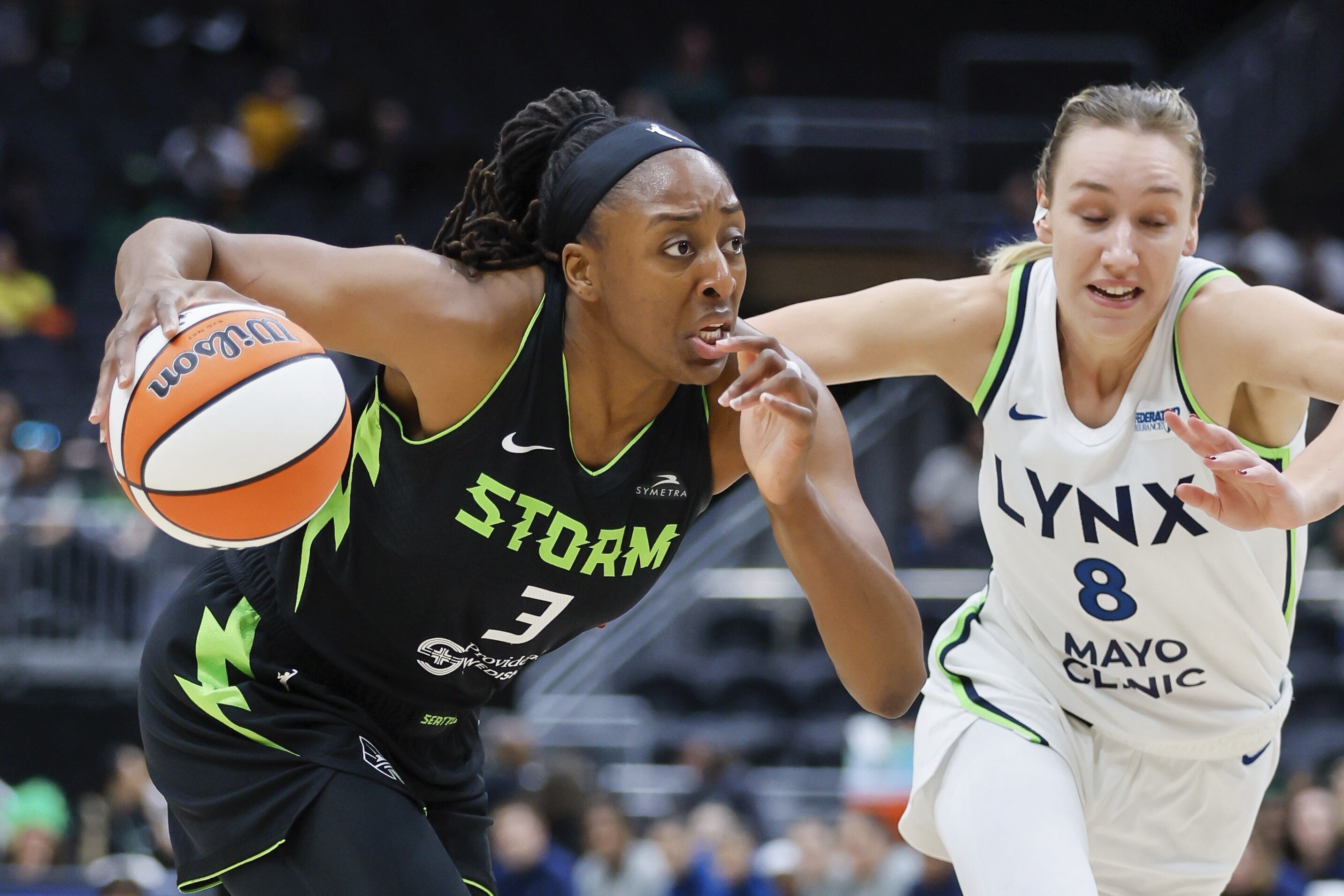 Seattle Storm forward Nneka Ogwumike drives to the basket past Minnesota Lynx forward Alanna Smith during the first quarter of a WNBA basketball game Tuesday, May 14, 2024, in Seattle. 