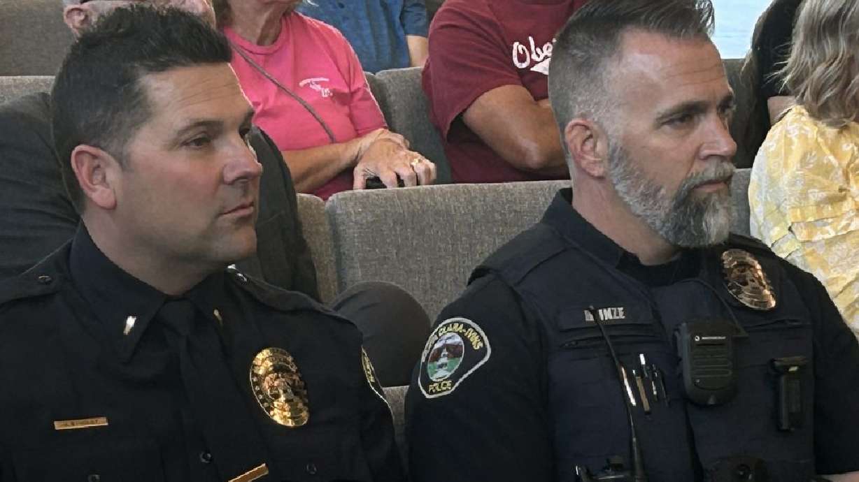 Before he is confirmed as the new Santa Clara-Ivins Police chief, Jaron Studley, left, sits alongside officer Jeremy Heinze, right, during the Ivins City Council meeting, Ivins, Thursday.