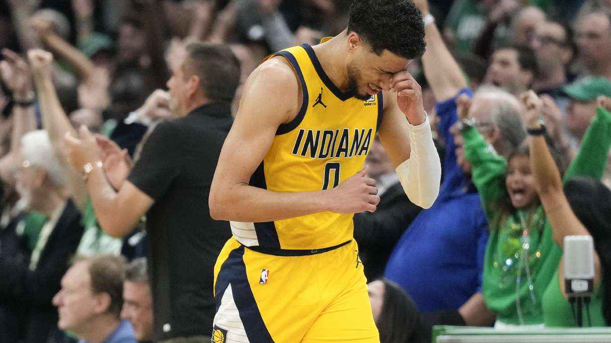 Indiana Pacers guard Tyrese Haliburton (0) reacts after missing a shot against the Boston Celtics to end regulation time in Game 1 of the NBA Eastern Conference basketball finals, Tuesday, May 21, 2024, in Boston.