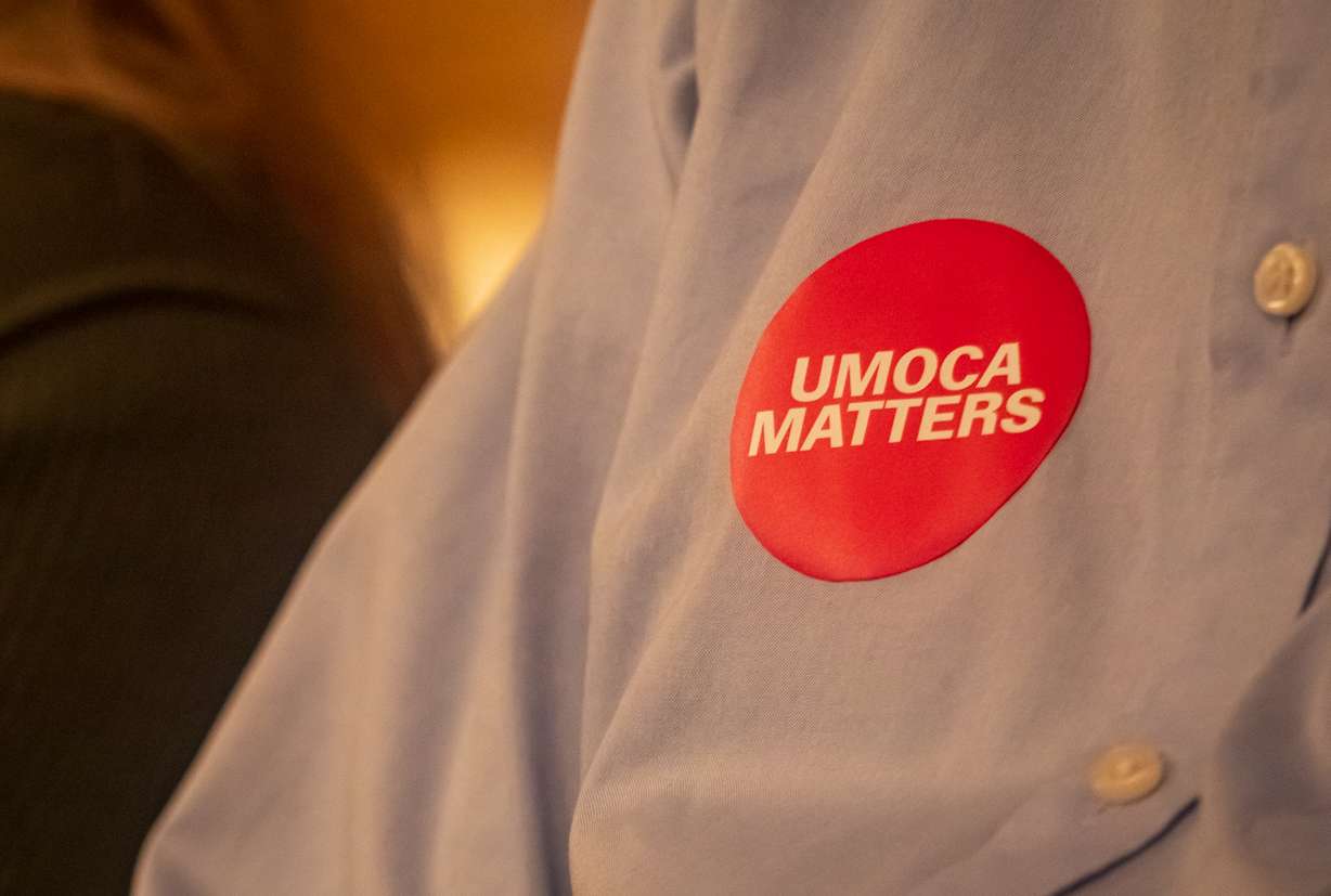 A resident wears a sticker supporting the Utah Museum of Contemporary Arts during a Salt Lake City Council public hearing Tuesday night.