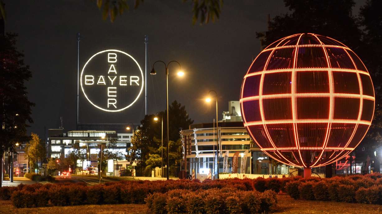 FILE - The Bayer logo is pictured at the main chemical plant of German Bayer AG on Thursday, Aug. 9, 2019 in Leverkusen, Germany. A low-rise city of 167,000 that grew up around the factories of the pharmaceuticals giant Bayer, Leverkusen has little to draw tourists besides its internationally famed soccer club. The team finished an entire German Bundesliga season unbeaten Saturday and is now targeting trophies in the Europa League and German Cup.