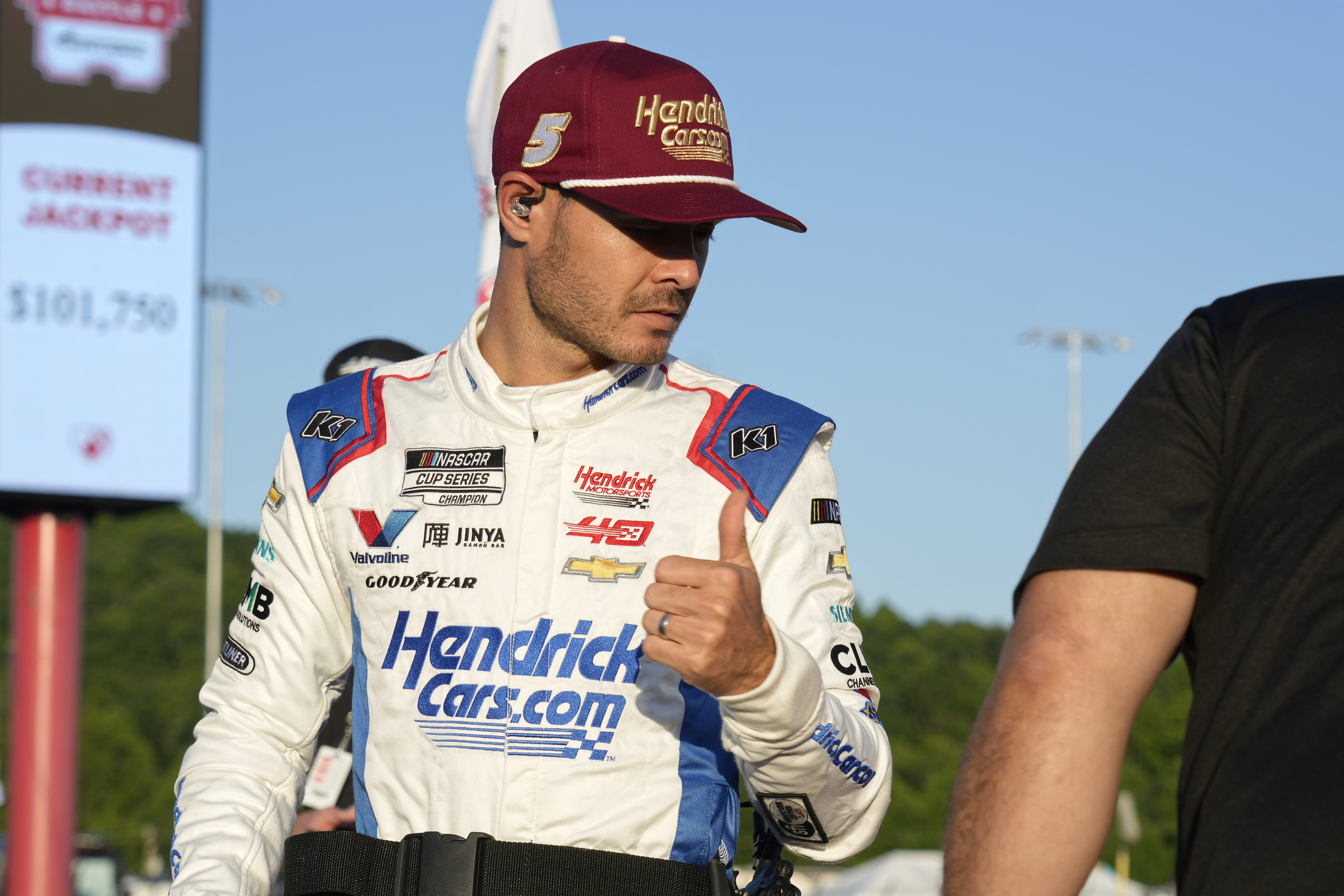 Kyle Larson gives a thumbs-up after arriving for the NASCAR All-Star auto race at North Wilkesboro Speedway in North Wilkesboro, N.C., Sunday, May 19, 2024. 