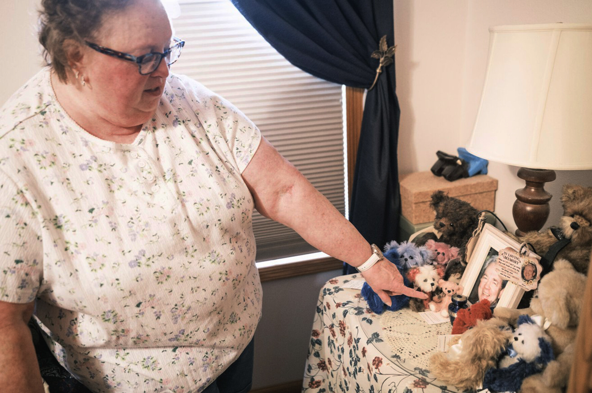 Nancy Gag Braun points to a small urn holding the ashes of her late husband Steve Braun, in her Mankato, Minn., bedroom on May 13. Many Americans are unprepared for finding long-term care for a loved one.